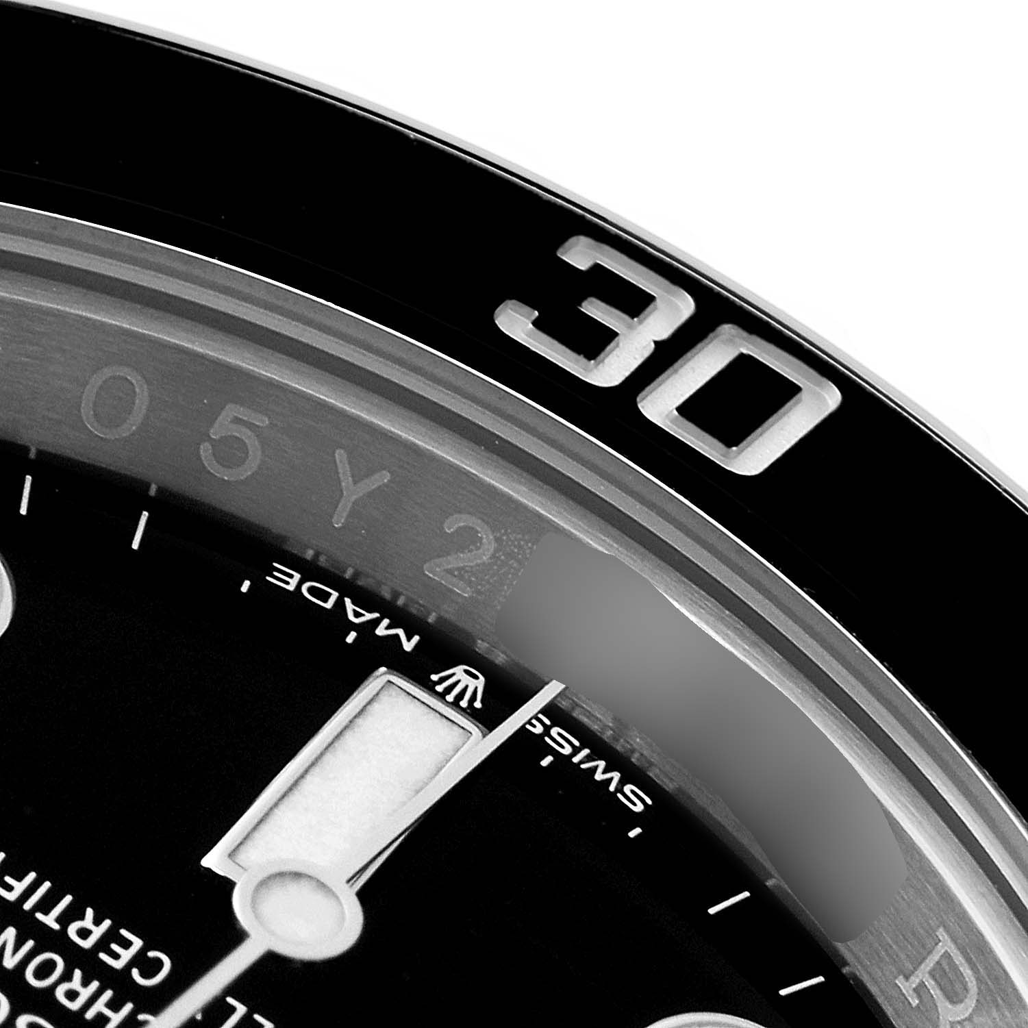 The image shows a close-up of the bezel and part of the dial of a Rolex Submariner 124060 Men
s Stainless Steel  124060 Men
s Stainless Steel , highlighting the "30" minute marker.