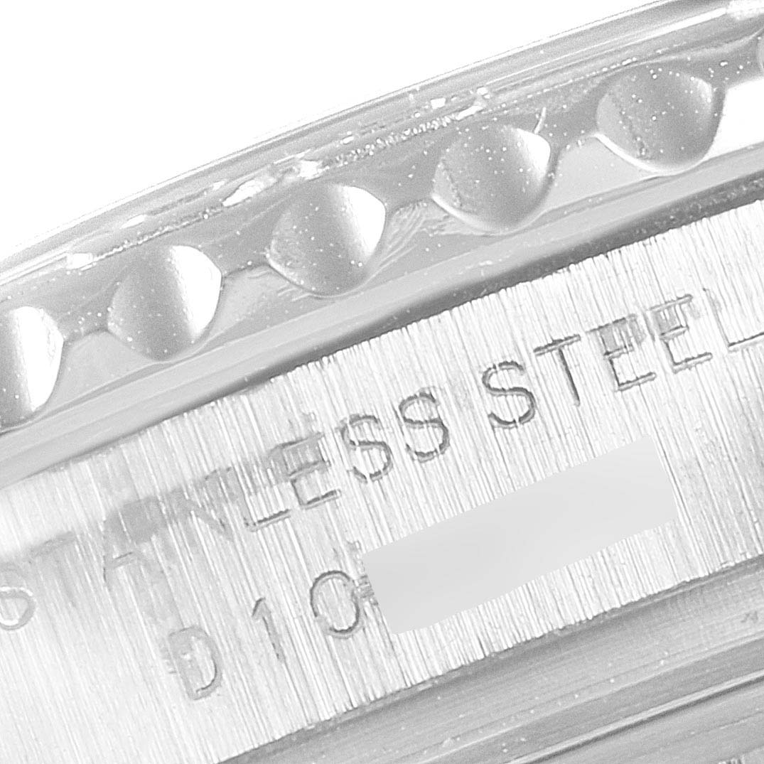 The image shows a close-up of the side of a Rolex Yacht-Master 169622 Women
s Stainless Steel Silver Dial 169622 Women
s Stainless Steel Silver Dial watch, specifically the knurled bezel and part of the case with "STAINLESS STEEL" engraving.