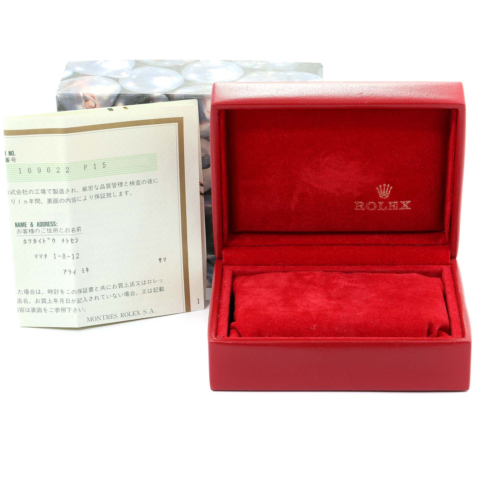 The image shows a red Rolex watch box for the Yacht-Master and accompanying documentation.