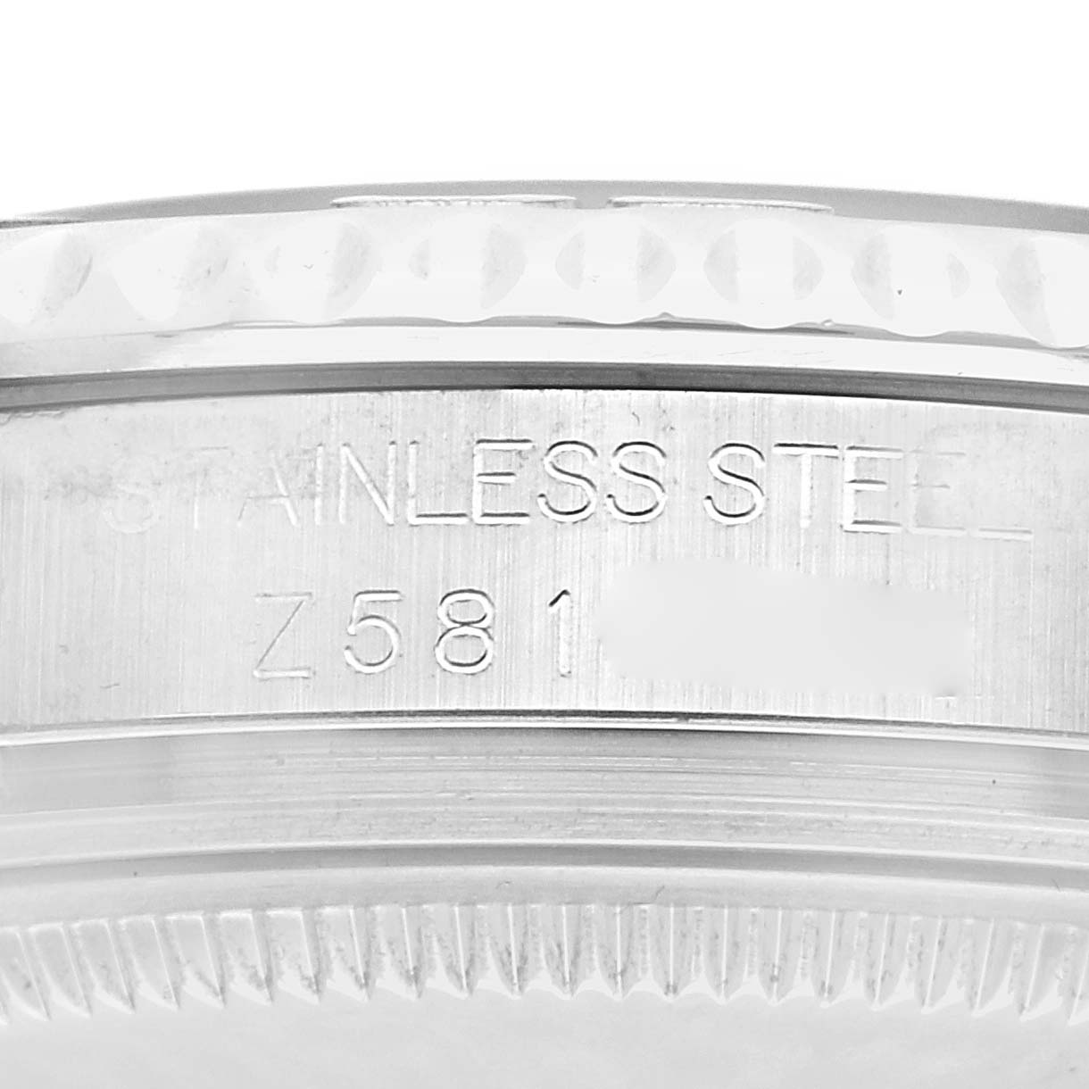 The image shows a close-up of the Rolex Yacht-Master 168622 Men
s Stainless Steel Silver Dial
s case edge, highlighting the stainless steel engraving.