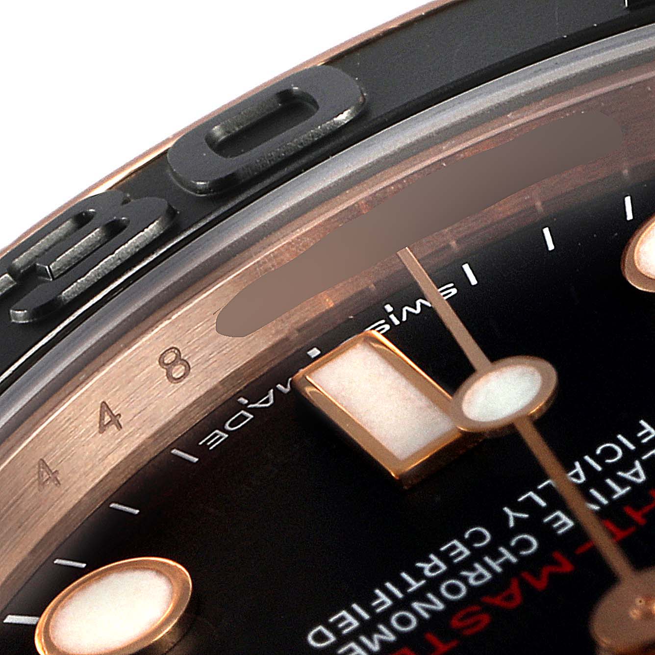 This close-up angle of the Rolex Yacht-Master 268655 Men's Rose Gold Black Dial 268655 Men's Rose Gold Black Dial watch shows part of the dial, bezel, and index markers.