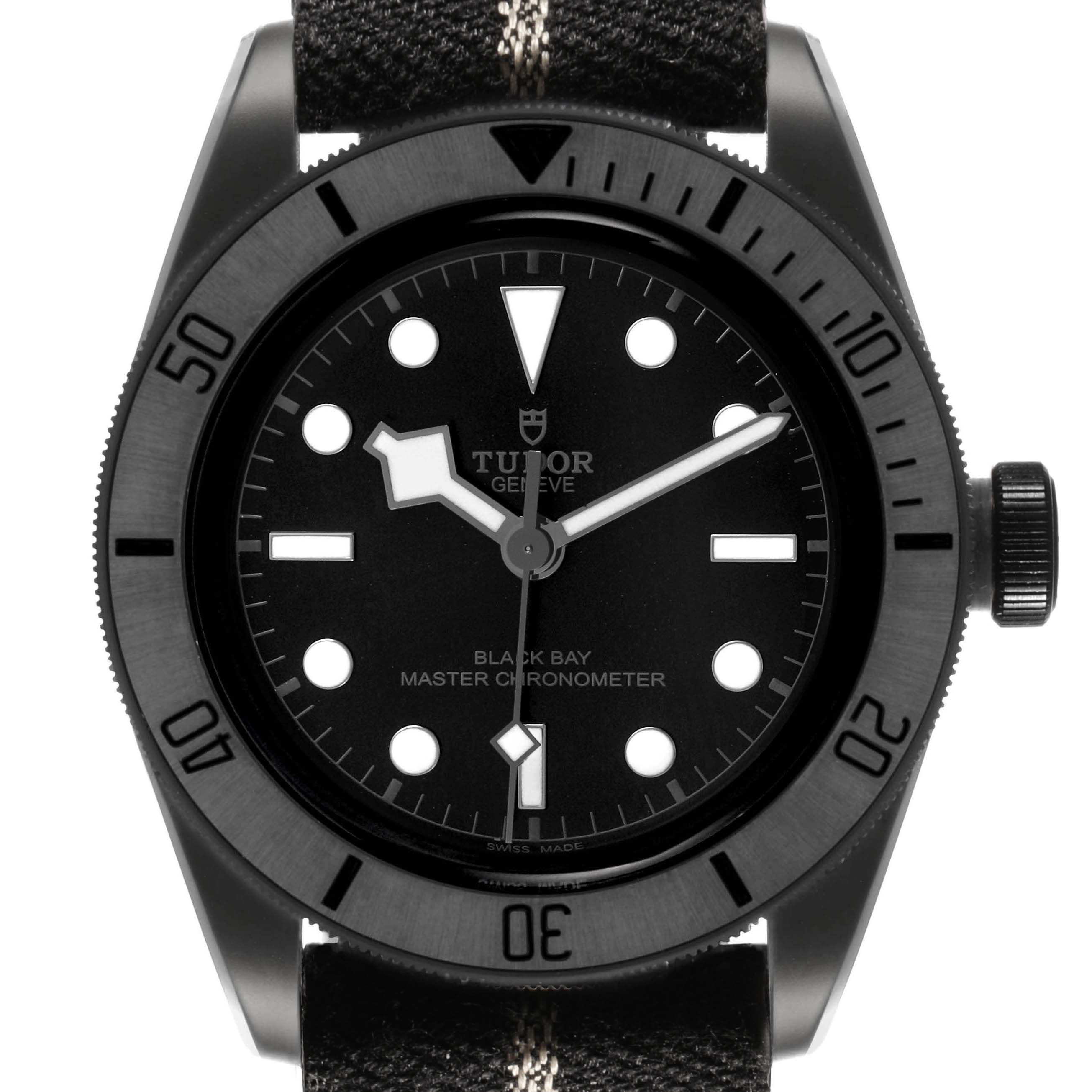 The image shows a front view of the Tudor Heritage Black Bay M79210CNU Men's Ceramic Black Dial watch, highlighting the dial, bezel, and crown.