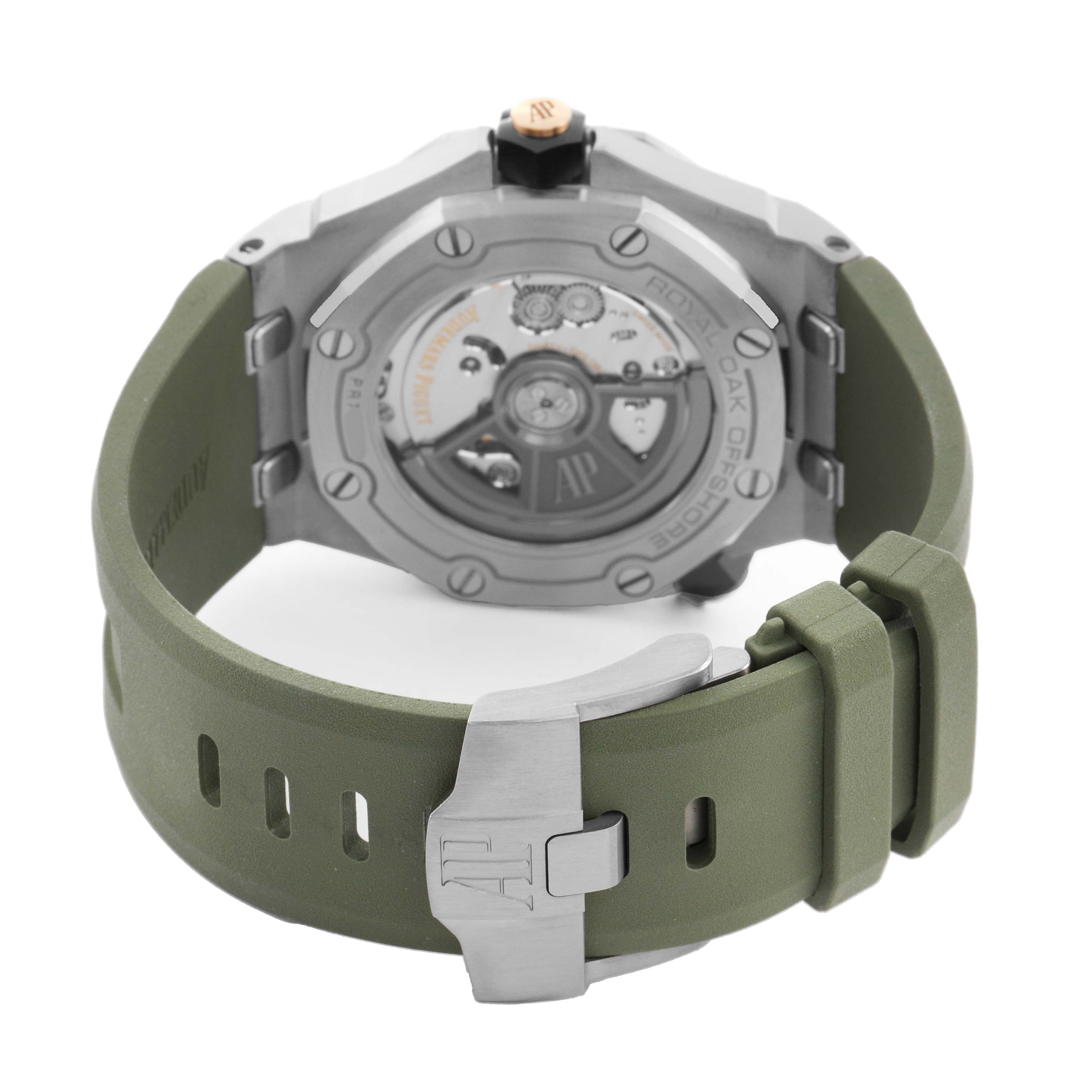 The image shows the back view of the Audemars Piguet Royal Oak Offshore 15720ST.OO.A052CA.01 Men's Stainless Steel Green Dial, highlighting the case back, rotor, and green strap with a clasp.