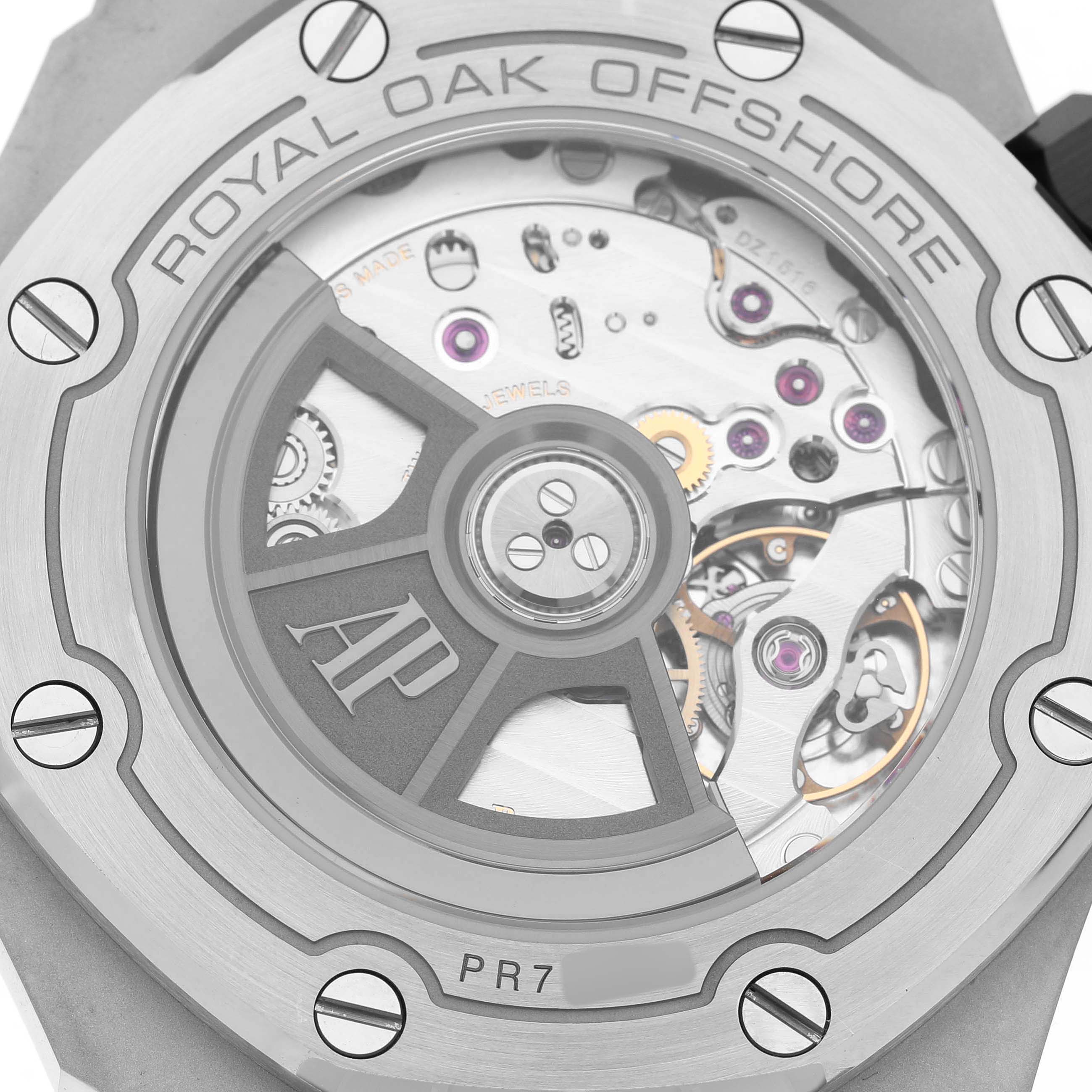 The image shows the exhibition case back of an Audemars Piguet Royal Oak Offshore 15720ST.OO.A052CA.01 Men's Stainless Steel Green Dial, highlighting the movement and rotor.