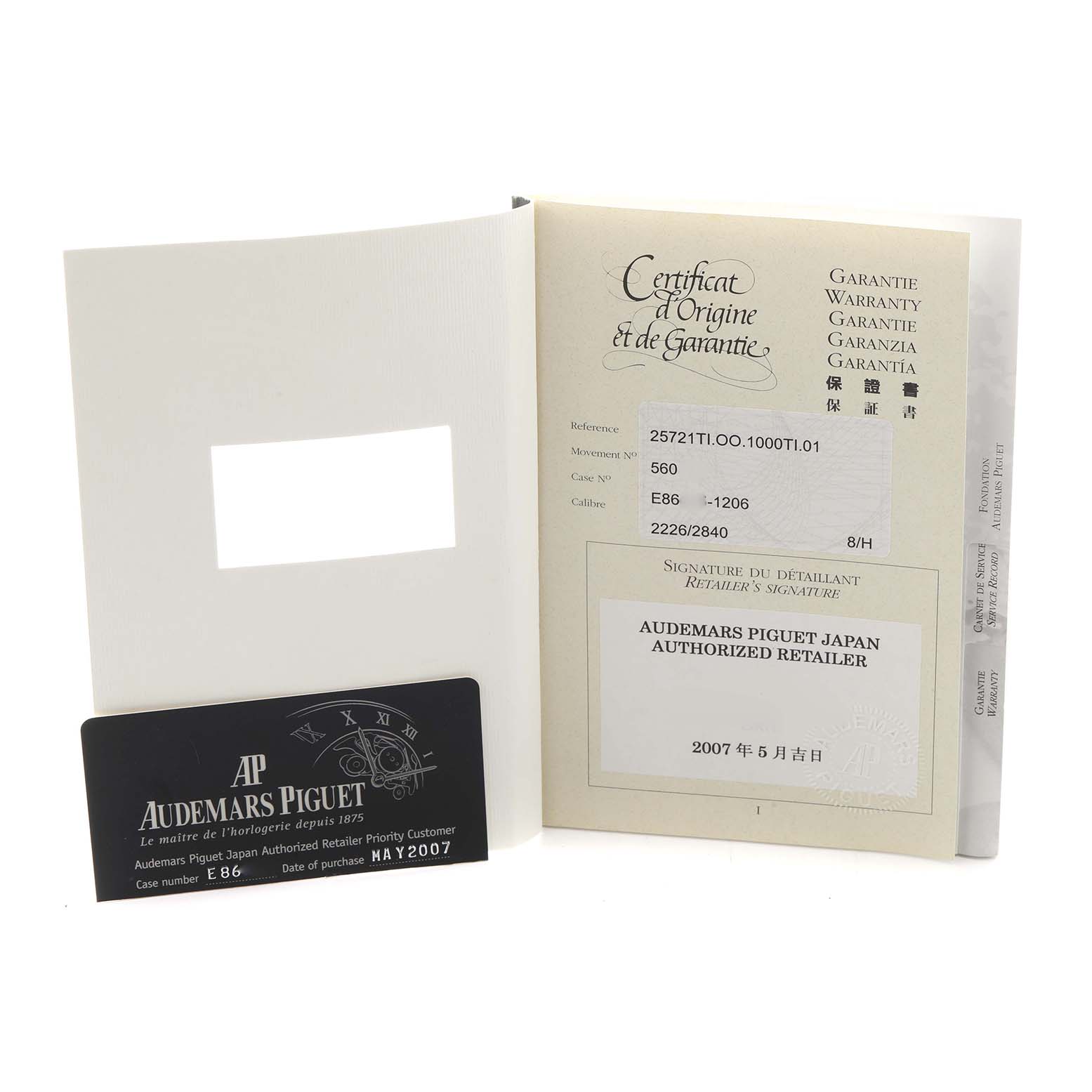 The image shows a warranty and certification card for the Audemars Piguet Royal Oak Offshore 25721TI.OO.10000TI.301 Men
s Titanium Grey Dial watch, along with documentation.