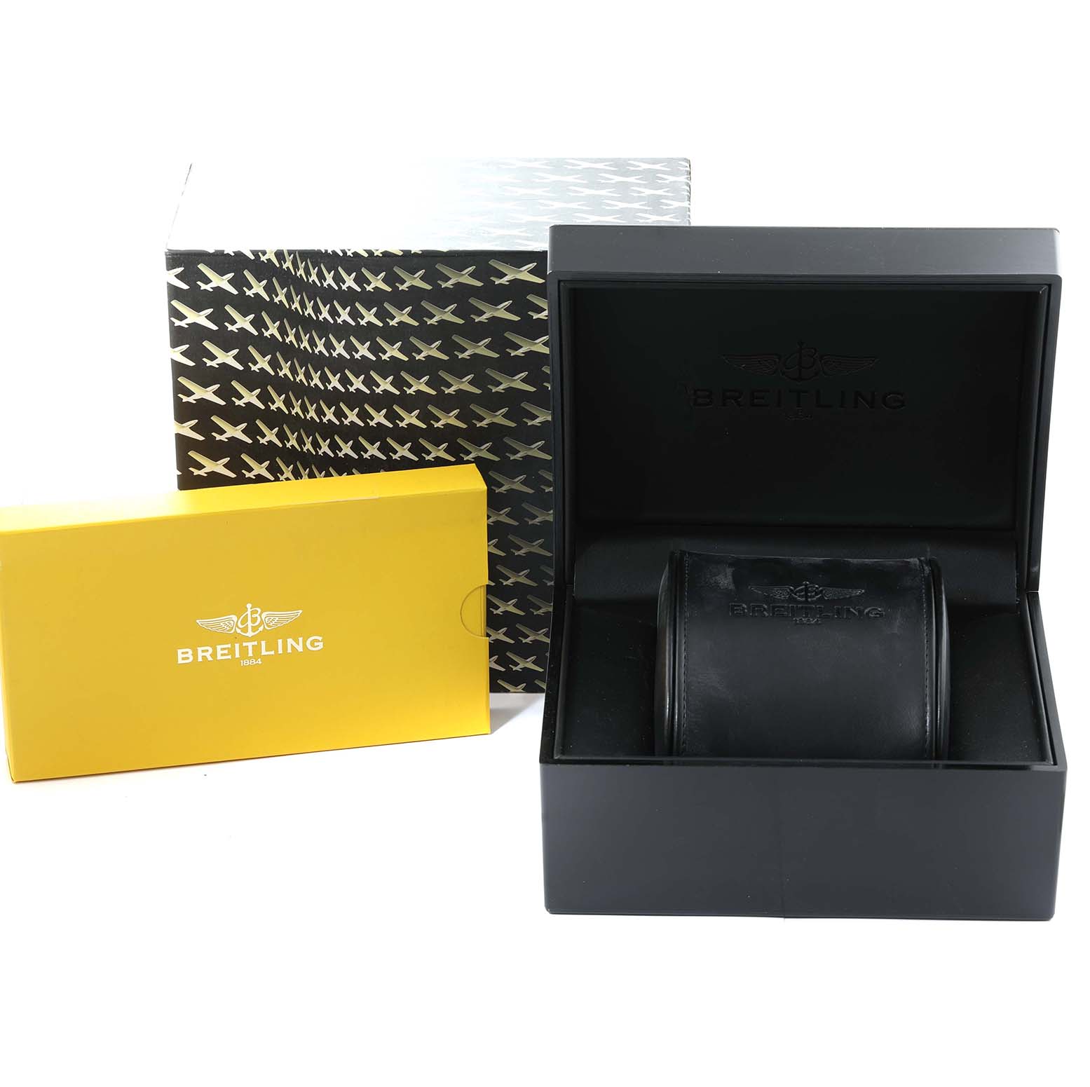 The image shows Breitling Bentley A25362 Men's Stainless Steel Black Dial A25362 Men's Stainless Steel Black Dial model watch accessories including a yellow box, a black inner box, and a cushioned watch holder.