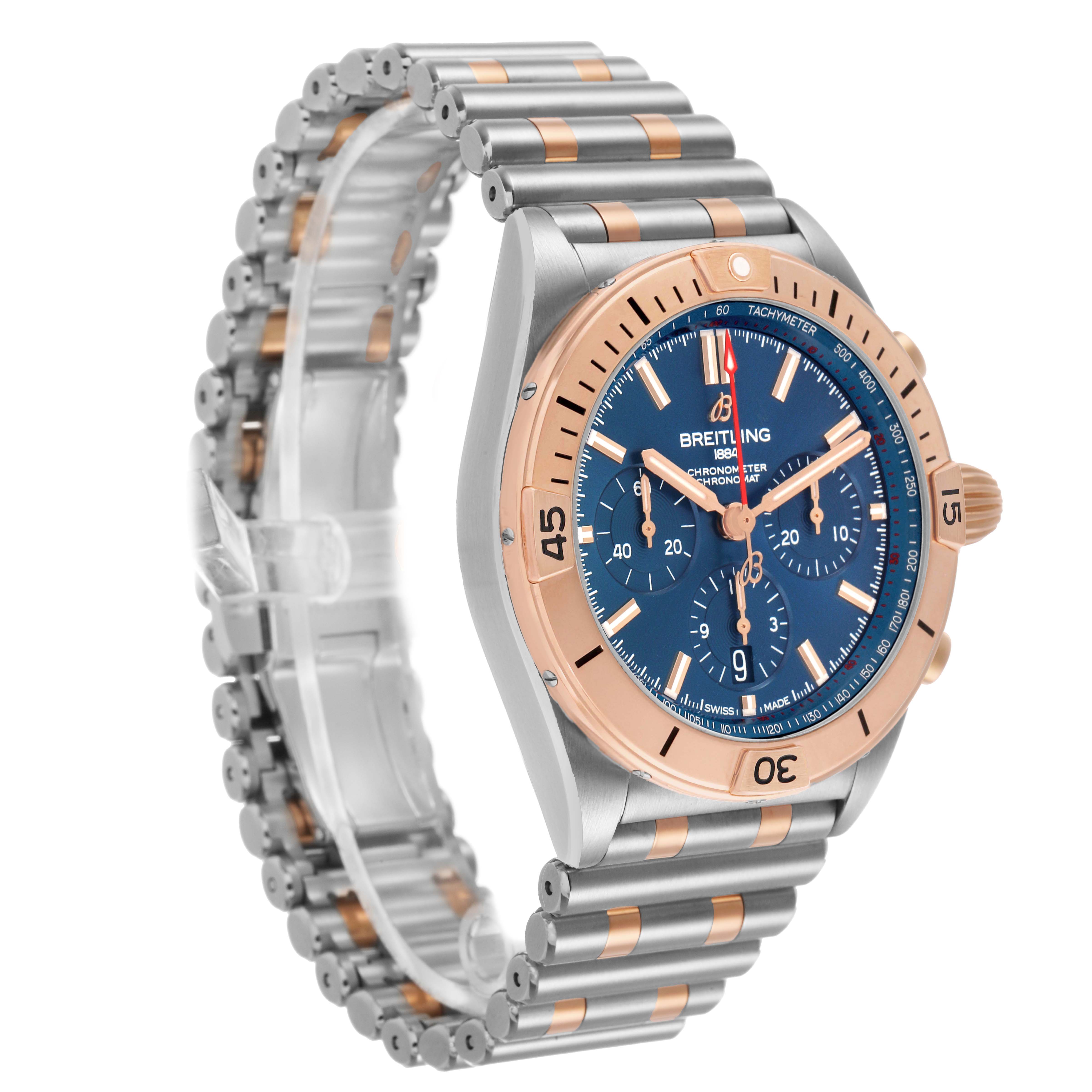 The Breitling Chronomat UB0134101C1U1 Men's Stainless Steel Blue Dial watch is shown at a three-quarter angle, highlighting the face, bezel, and bracelet.