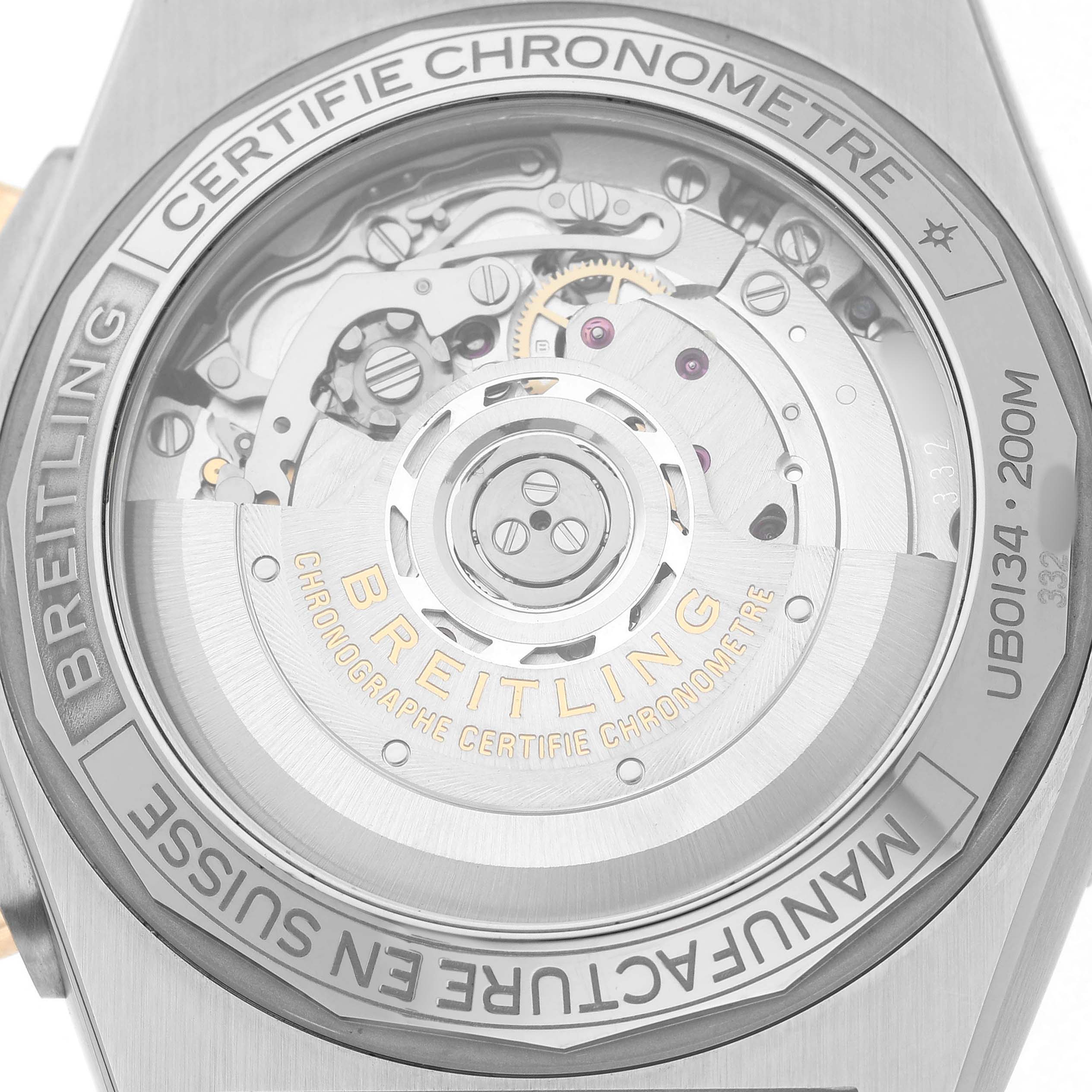 The image shows the back of a Breitling Chronomat UB0134101C1U1 Men's Stainless Steel Blue Dial watch, highlighting its internal mechanism and rotor through a transparent case back.