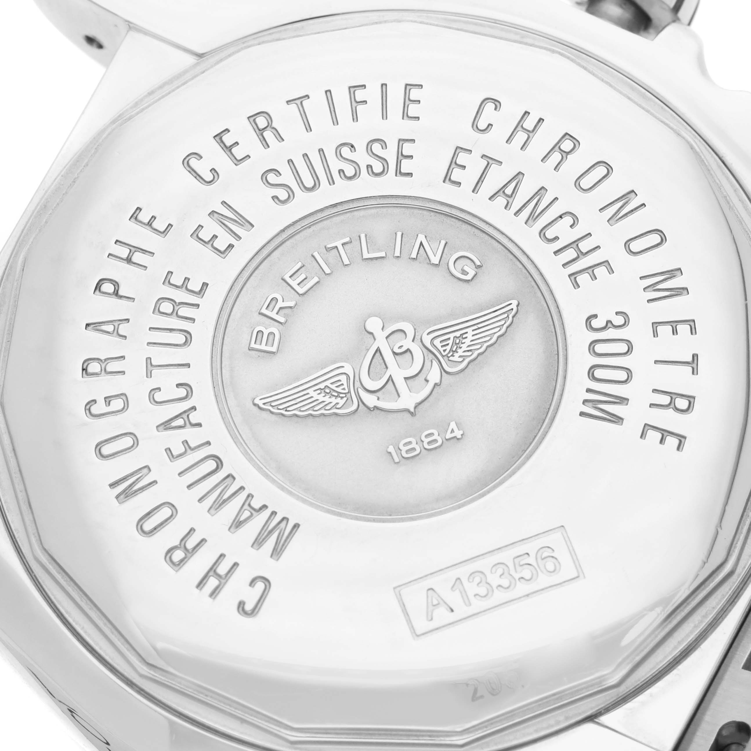 The image shows the engraved case back of a Breitling Chronomat A13356 Men
s Stainless Steel Silver Dial watch, displaying brand details and model number.