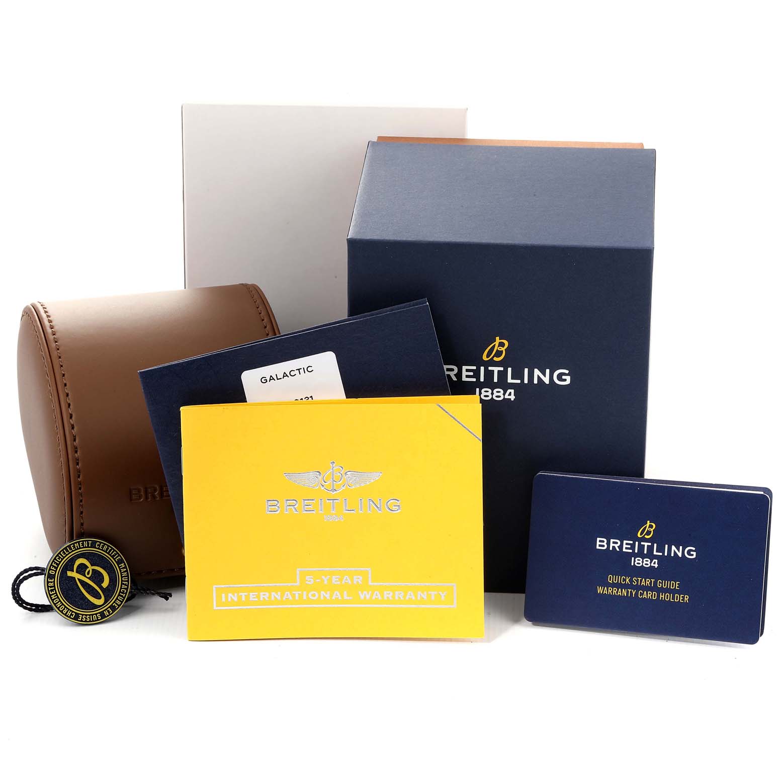 The image shows the packaging and accessories, including warranty cards, for the Breitling A37330 Women's Stainless Steel Silver Dial A37330 Women's Stainless Steel Silver Dial Galactic 36 Silver Dial Steel Ladies Watch model A37330.