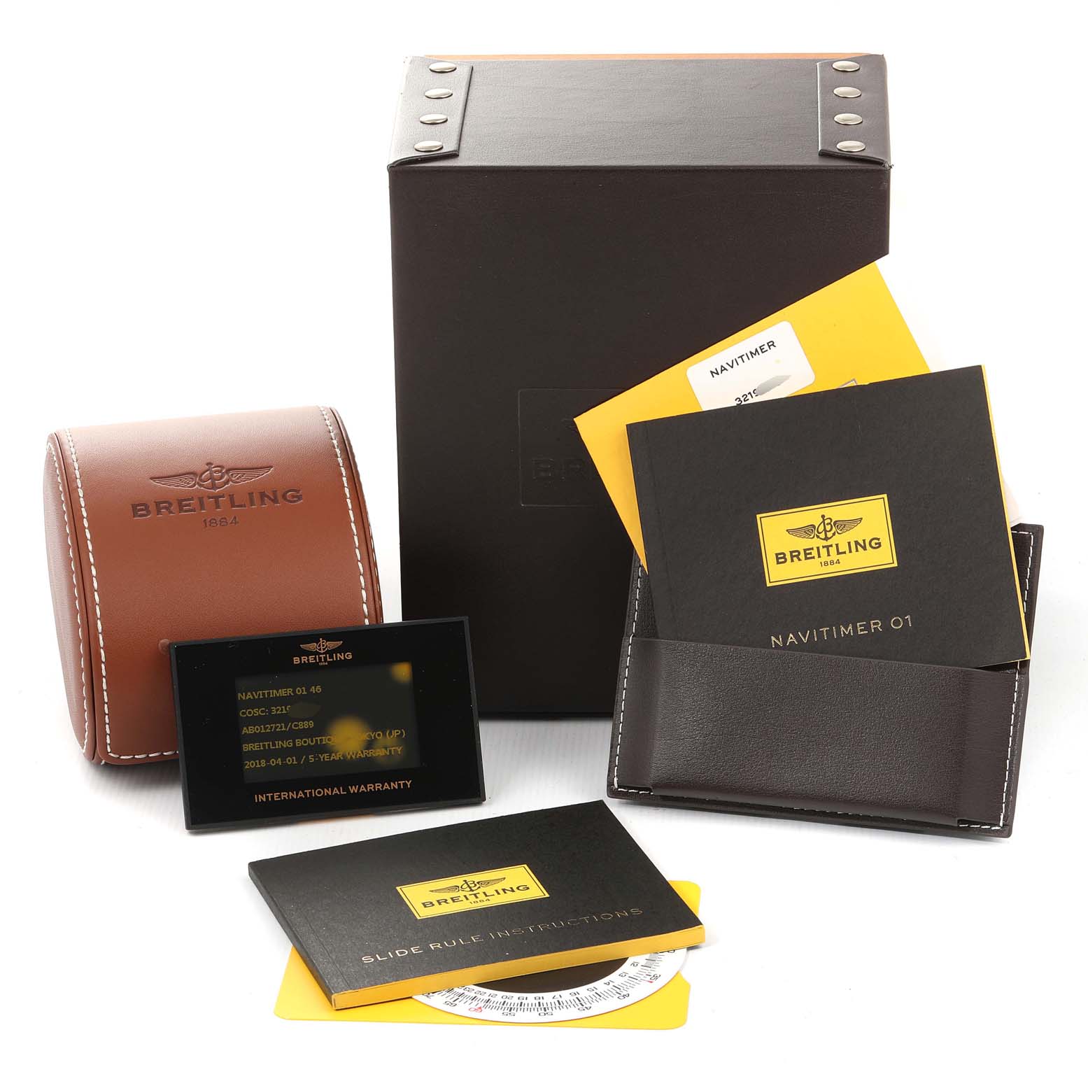 The image shows the packaging and accessories of a Breitling Navitimer AB012721-C889-453A Men's Stainless Steel Blue Dial AB012721-C889-453A Men's Stainless Steel Blue Dial watch, including manuals, warranty cards, and a leather case.