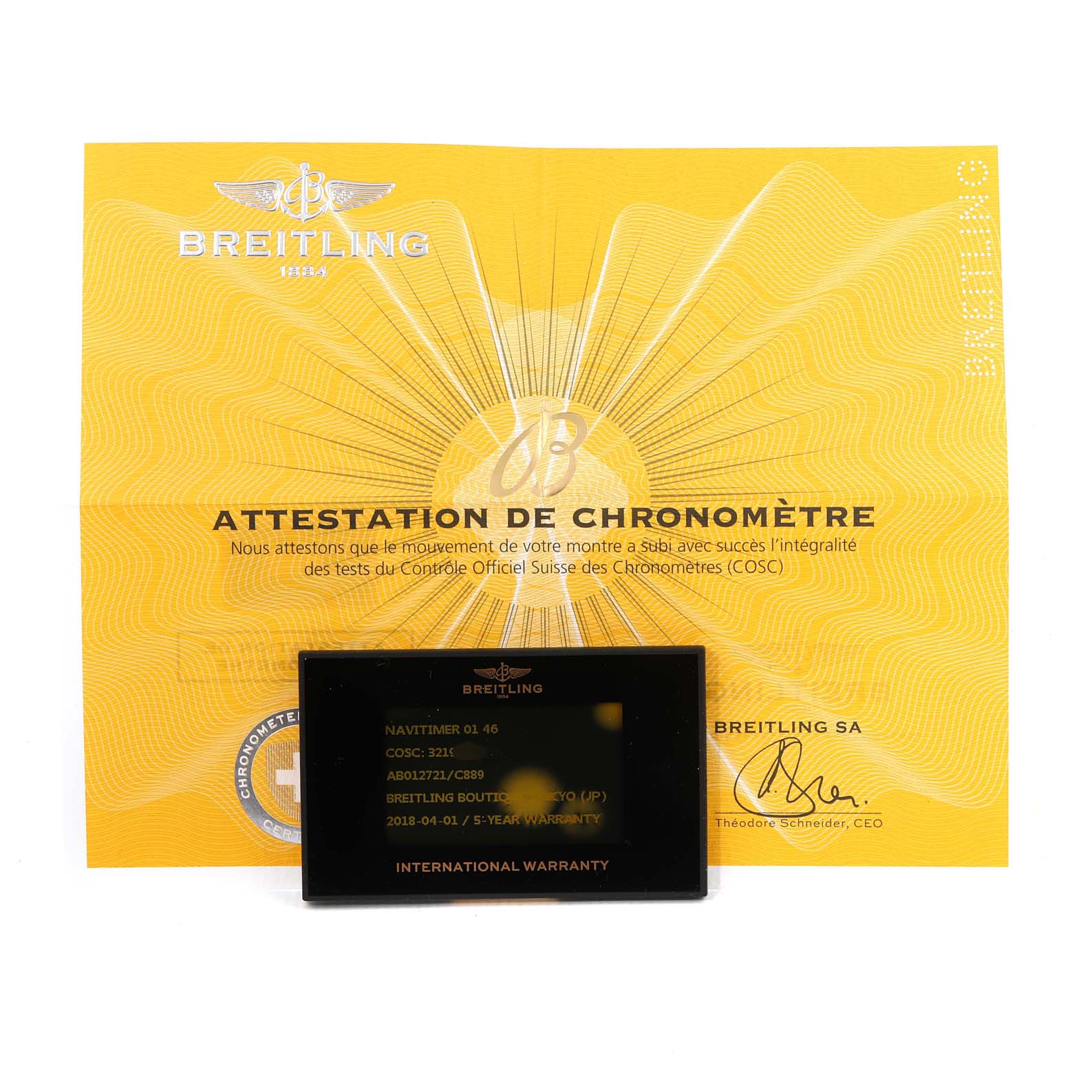 The image shows the Breitling Navitimer AB012721-C889-453A Men's Stainless Steel Blue Dial AB012721-C889-453A Men's Stainless Steel Blue Dial model's COSC certificate and international warranty card placed on top of it.