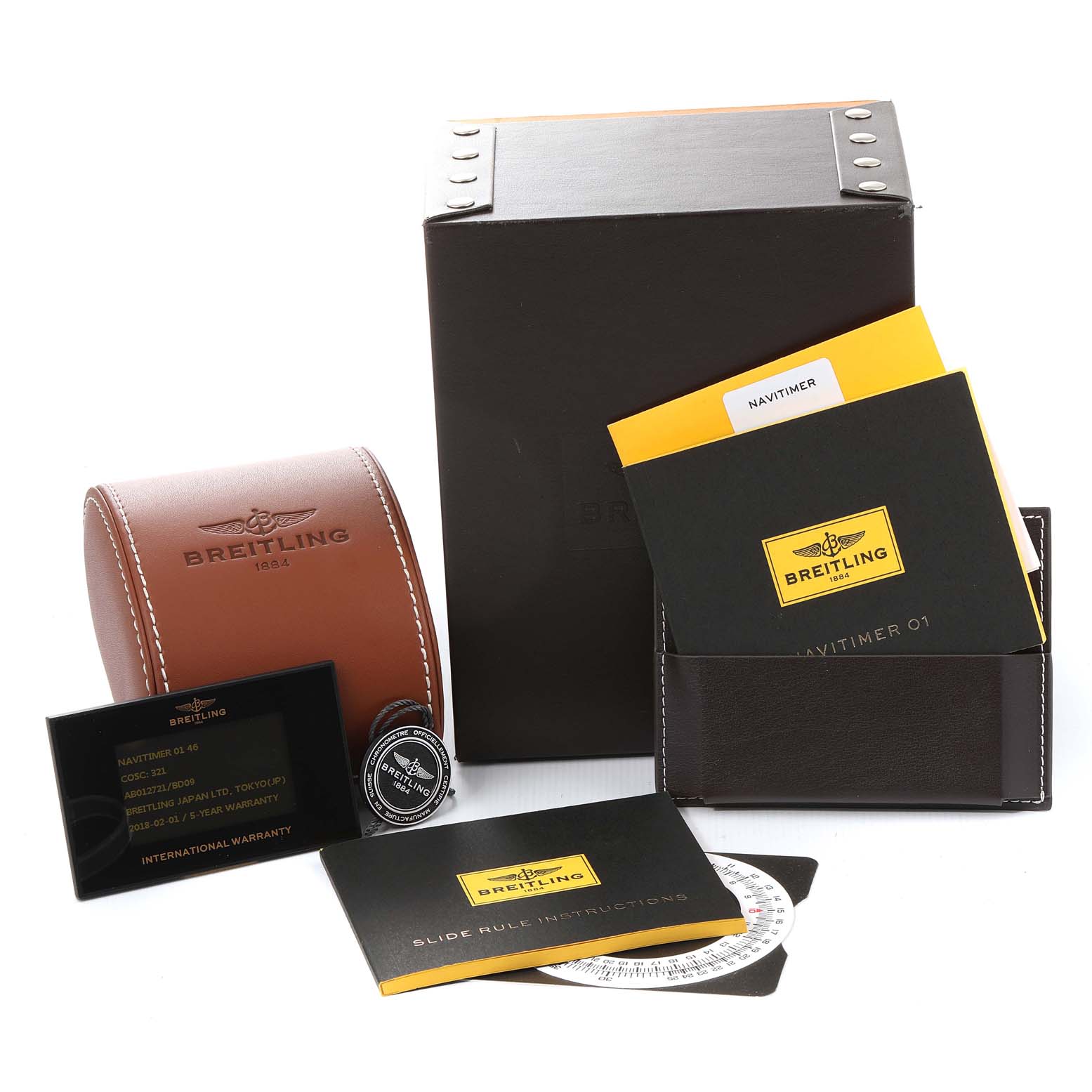 The image shows a Breitling Navitimer AB0127-211-B1A1 Men
s Stainless Steel Black Dial AB0127-211-B1A1 Men
s Stainless Steel Black Dial watch box, cardholder with documents, a leather case, and an international warranty card on an angled view.