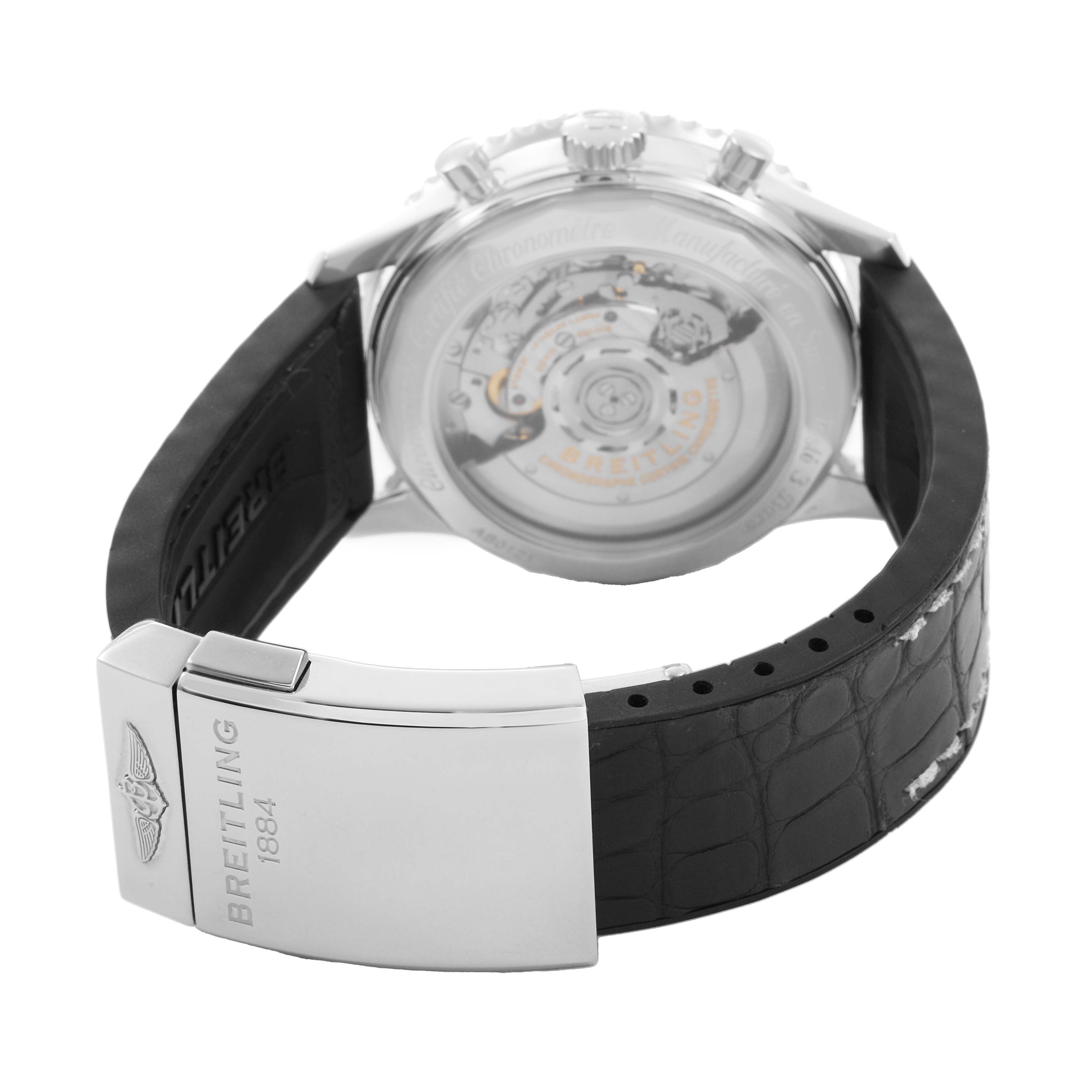 The image shows the back of a Breitling Navitimer AB0121 Men's Stainless Steel Silver Dial watch, highlighting the movement and leather strap with clasp.