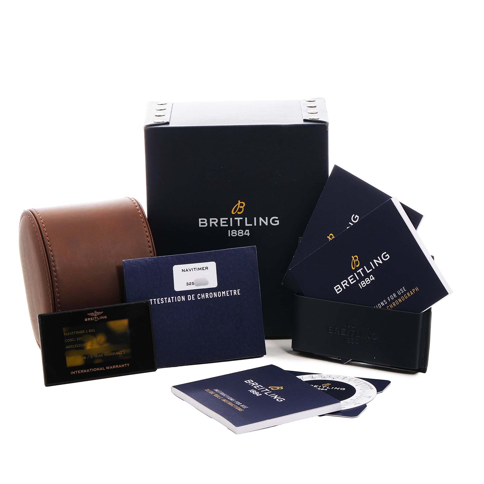 The image shows a Breitling Navitimer AB0121 Men's Stainless Steel Silver Dial box set with a watch case, warranty card, manuals, and documents from a front angle.