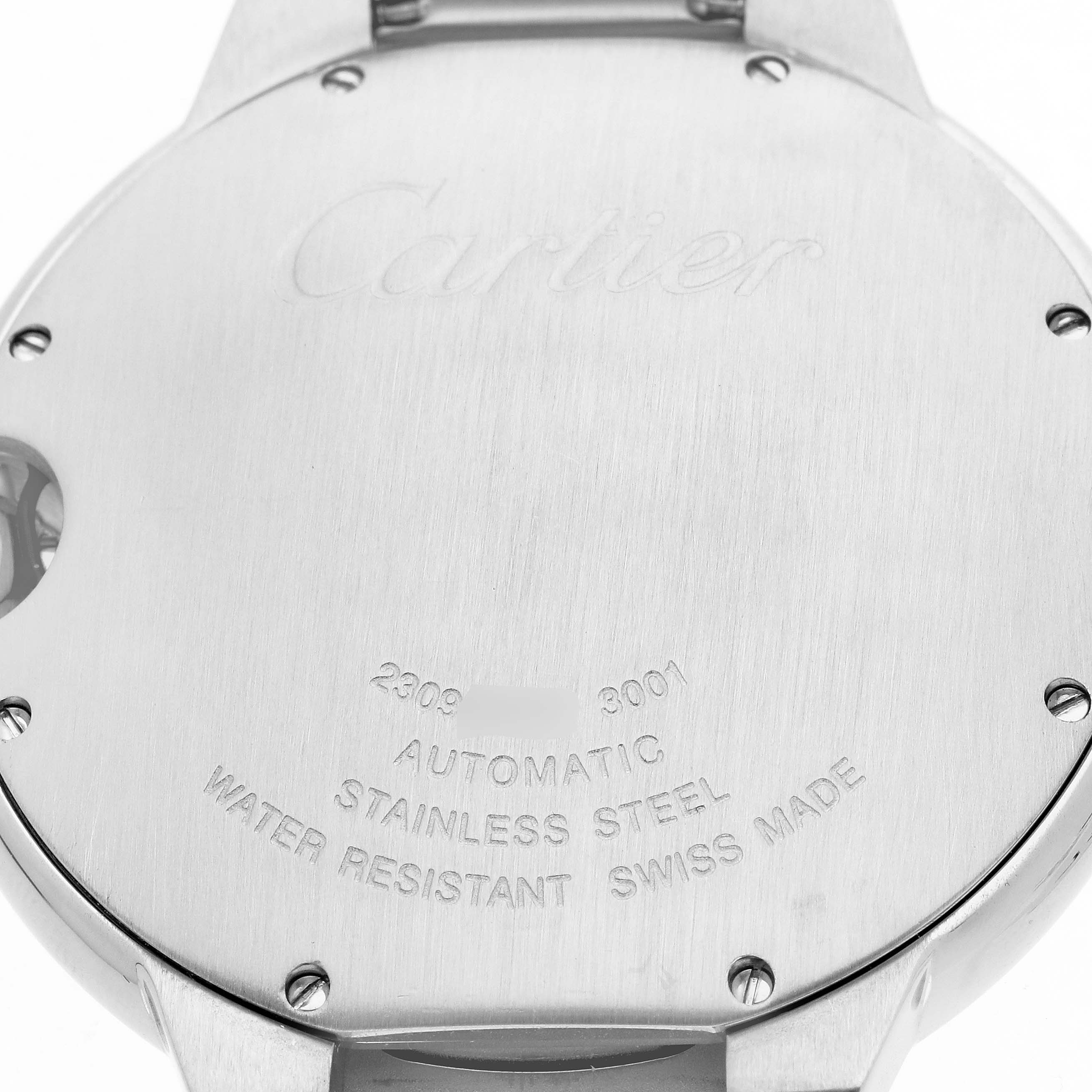 The image shows the back case of a Cartier Ballon Bleu W69012Z4 Men
s Stainless Steel Silver Dial watch, highlighting the engravings and stainless steel material.