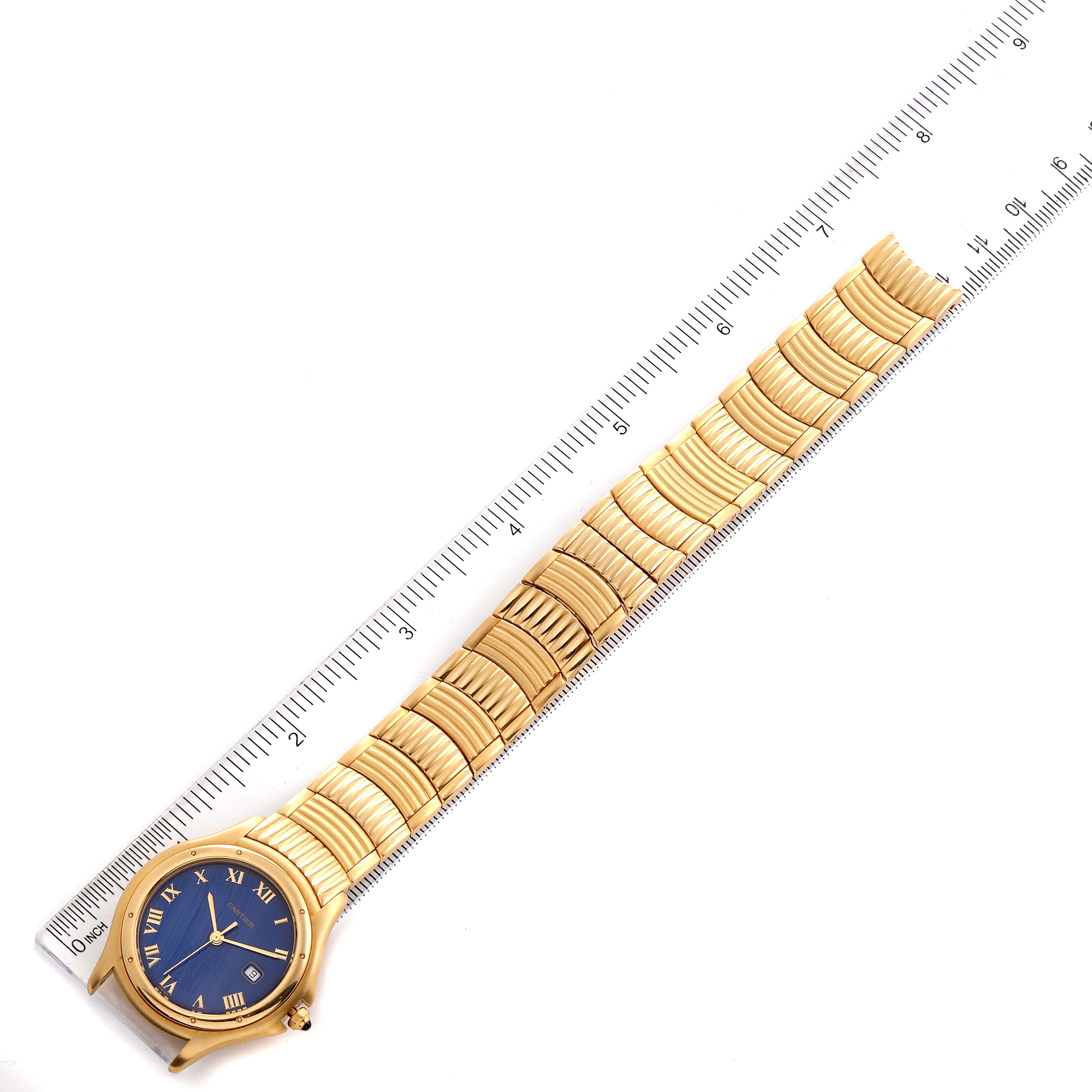 The image shows the Panthere model by Cartier from a top-down angle, showcasing the watch face, bracelet, and a ruler for scale.
