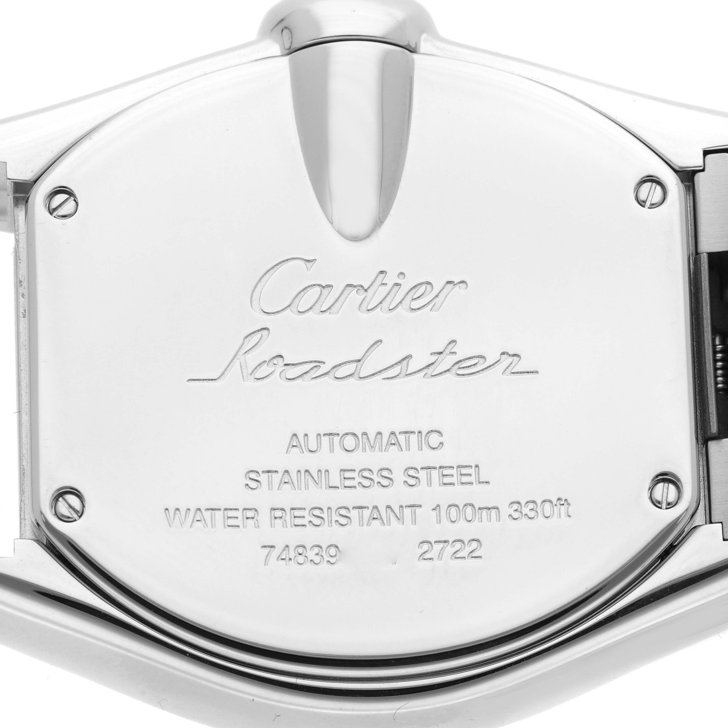The image shows the case back of a Cartier Roadster W62032X6 Men
s Stainless Steel Silver Dial watch, highlighting engravings and material.