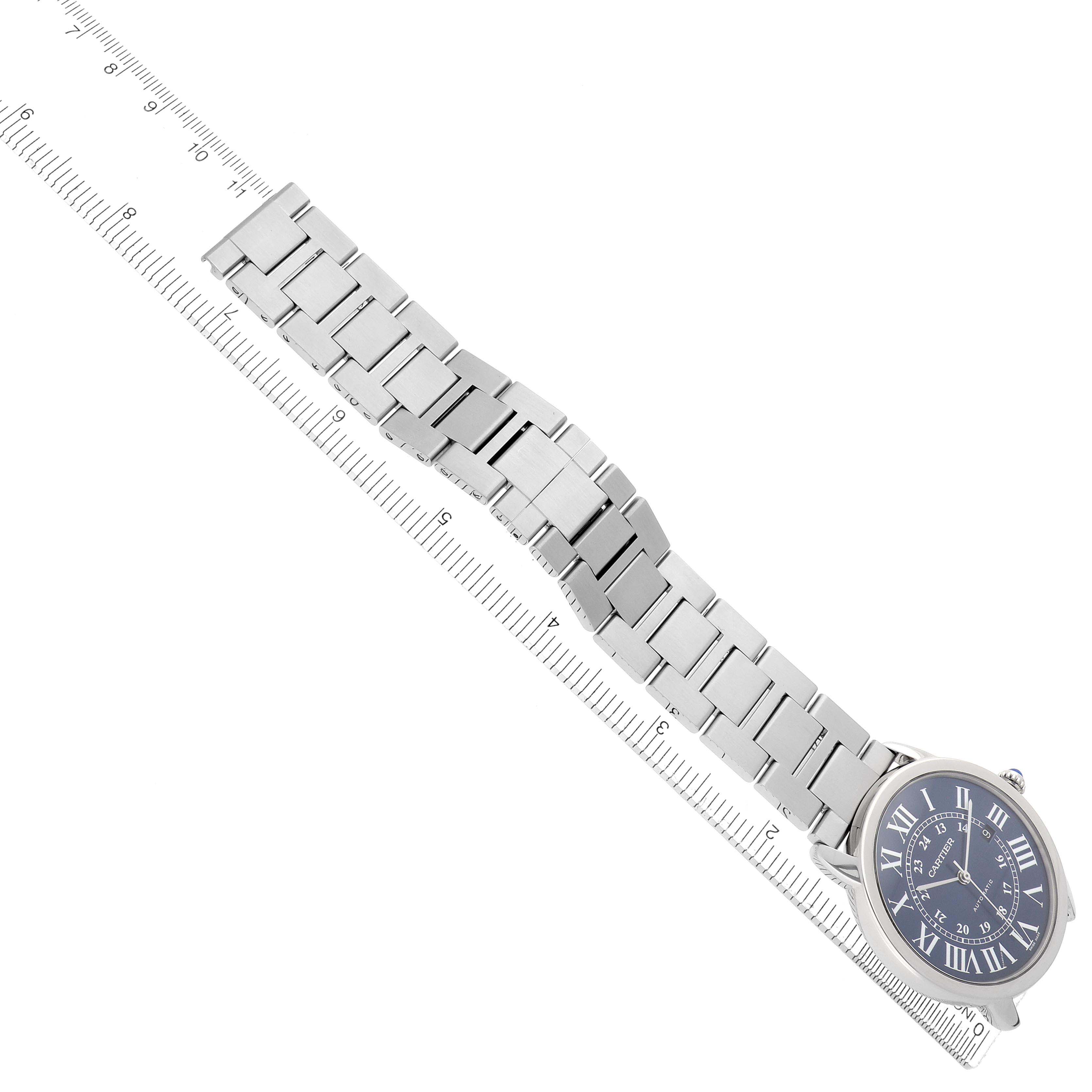 The image shows a Cartier Ronde WSRN0023 Men
s Stainless Steel Blue Dial watch at an angled view, displaying the face, metal bracelet, and part of the clasp.
