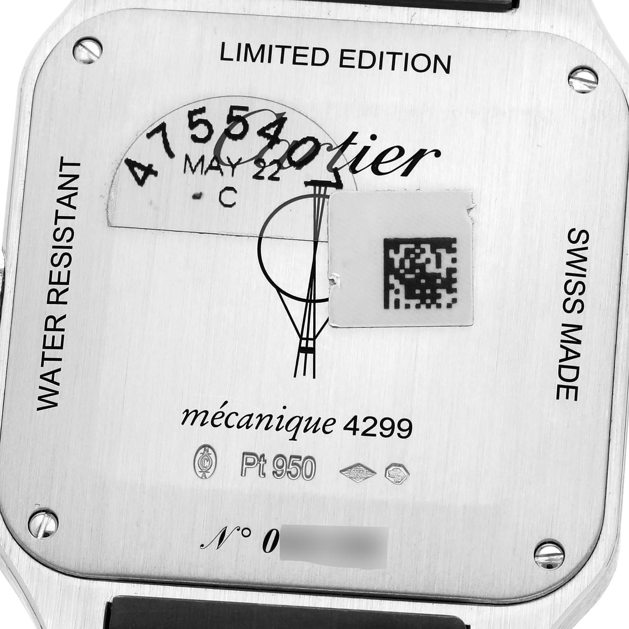 The image shows the back casing of a limited edition Cartier Santos Dumont WGSA0034 Men
s Platinum Silver Dial WGSA0034 Men
s Platinum Silver Dial watch with engravings and a QR code.