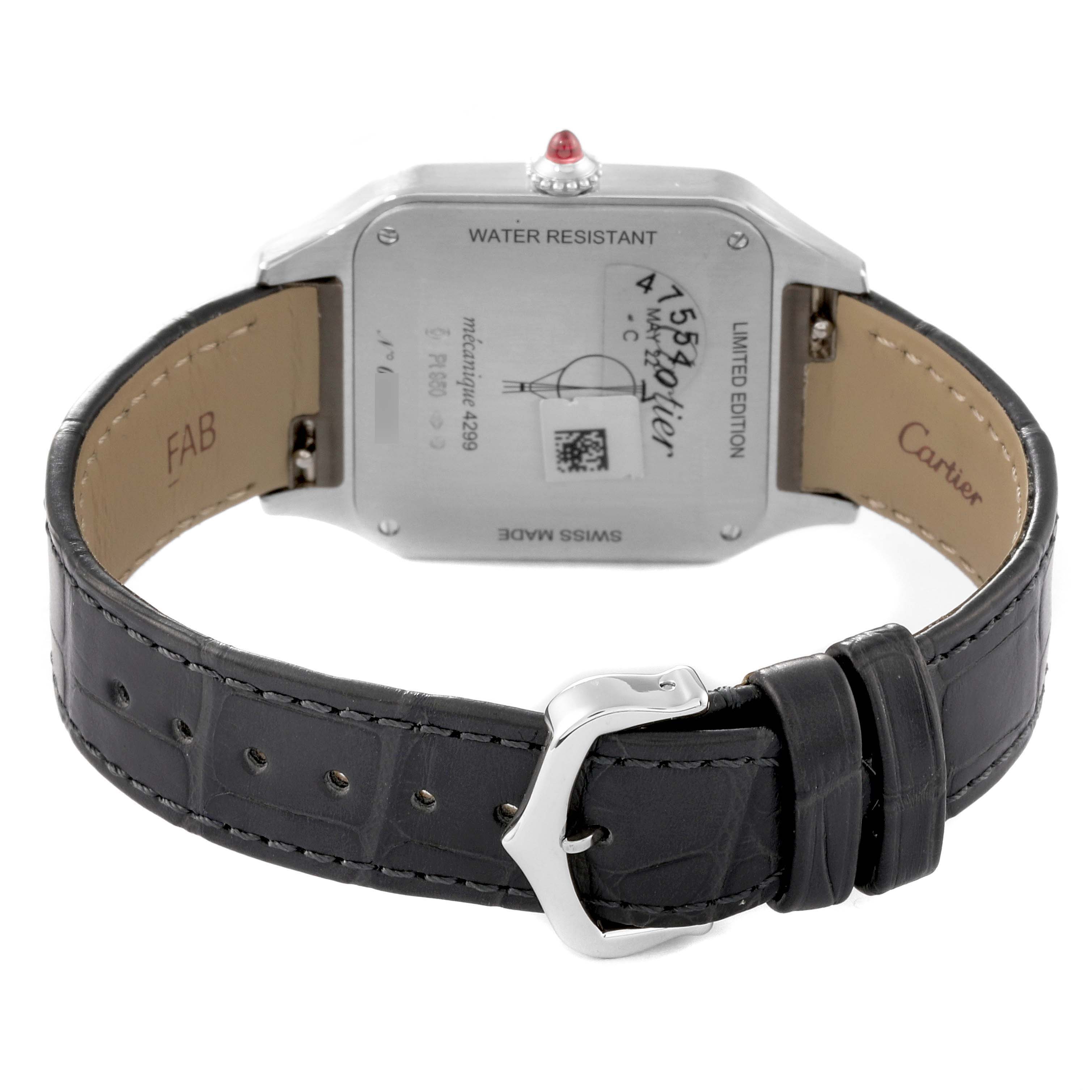 The image shows the back of a Santos Dumont model by Cartier, featuring the case back and leather strap with a buckle.