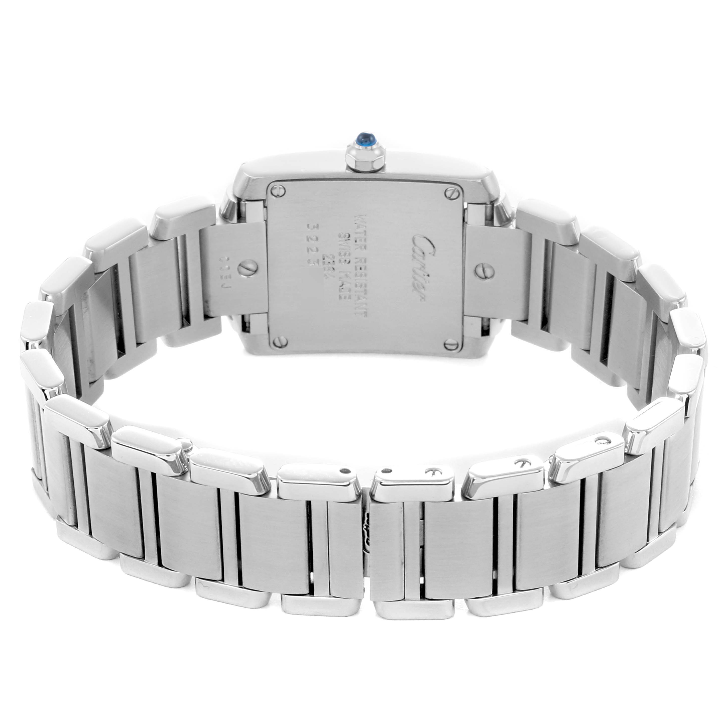 The Cartier Tank Française watch is shown from the back, highlighting its case, bracelet, and crown.
