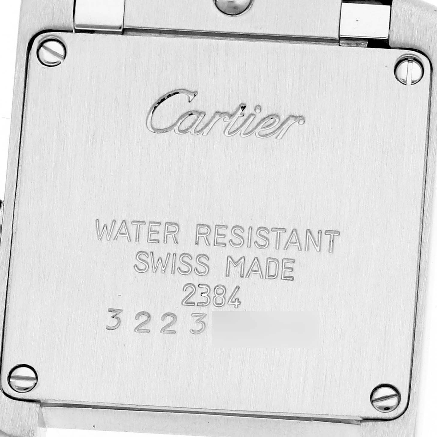 The image shows the back case of a Cartier Tank Française watch, displaying the brand name and specifications.