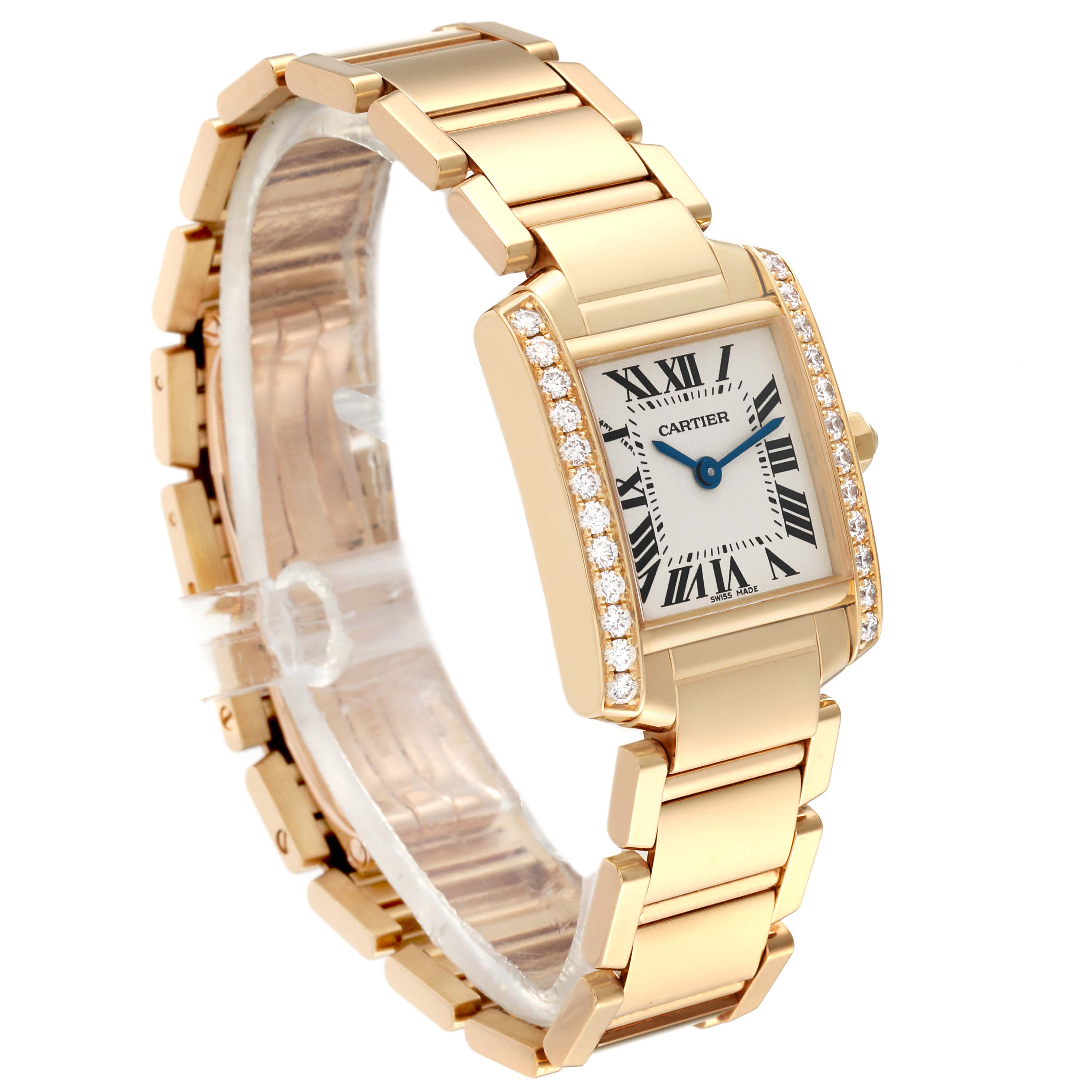 The image shows a Cartier Tank Francaise WE1001R8 Women's Yellow Gold Silver Dial WE1001R8 Women's Yellow Gold Silver Dial watch, focusing on its gold bracelet, diamond-set bezel, and rectangular dial from an angled side view.