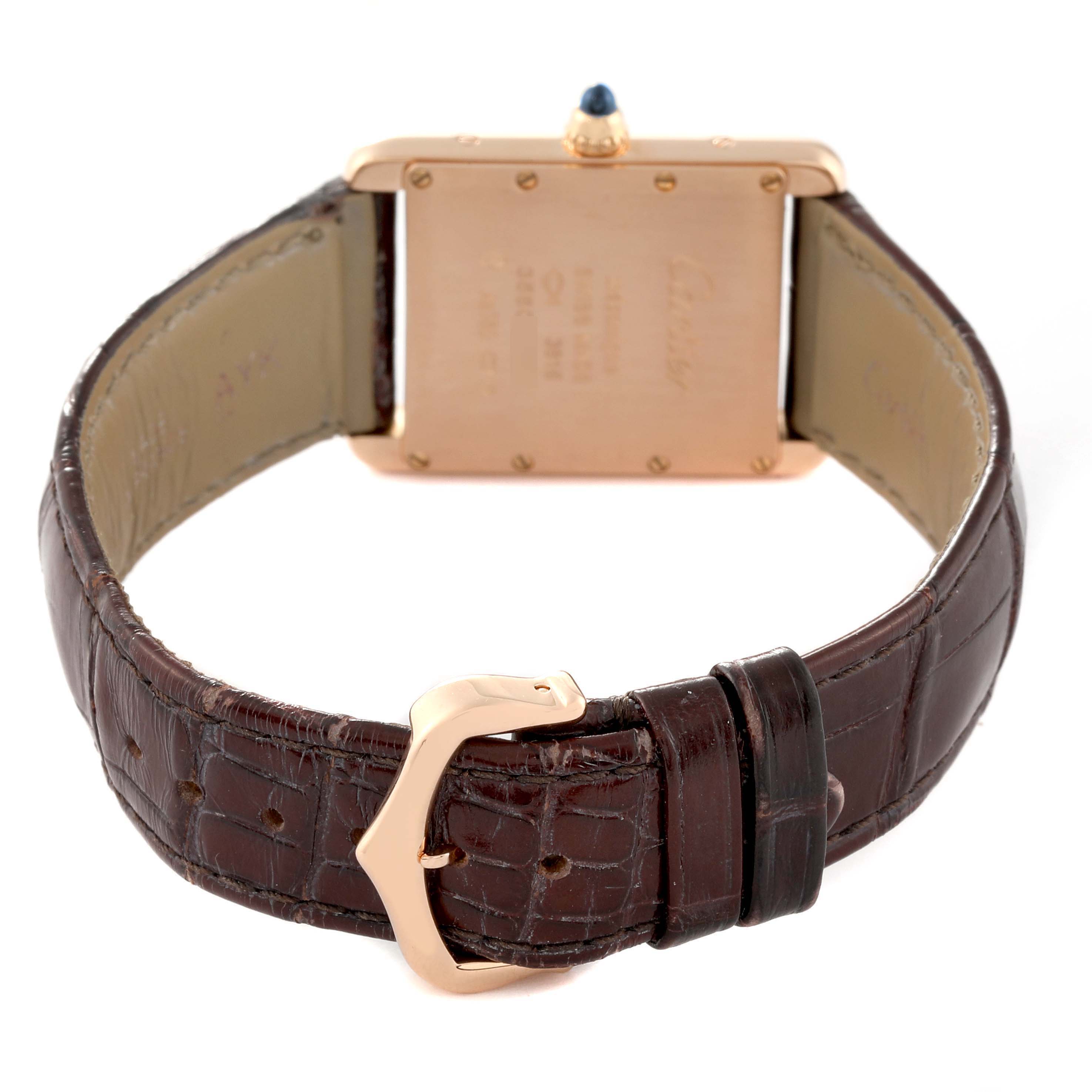 The image shows the back view of the Cartier Tank Louis WGTA0011 Men's Rose Gold Silver Dial WGTA0011 Men's Rose Gold Silver Dial watch, highlighting its leather strap and gold buckle.