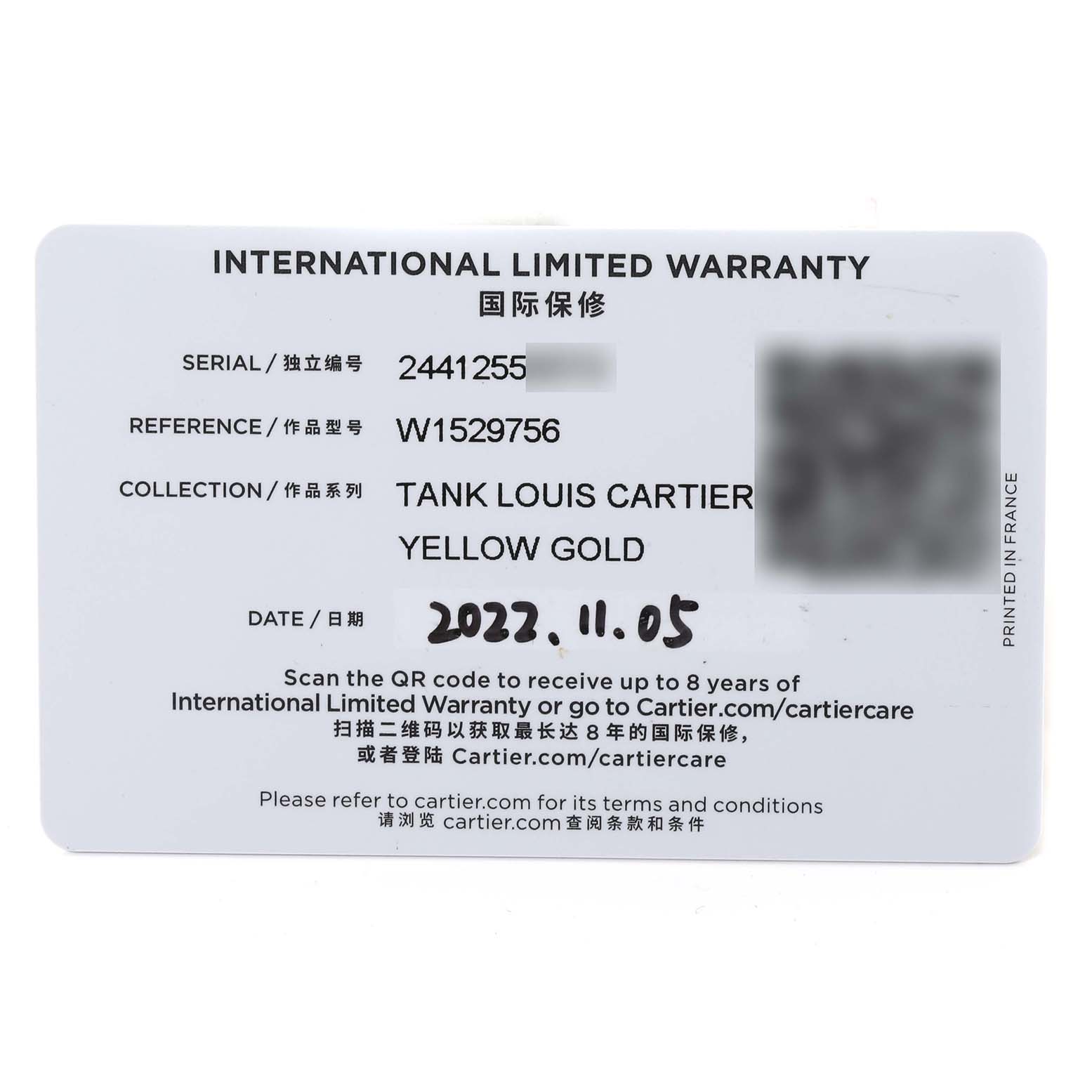 This image shows the international limited warranty card for the Tank Louis Cartier Yellow Gold watch, detailing the serial and reference numbers.