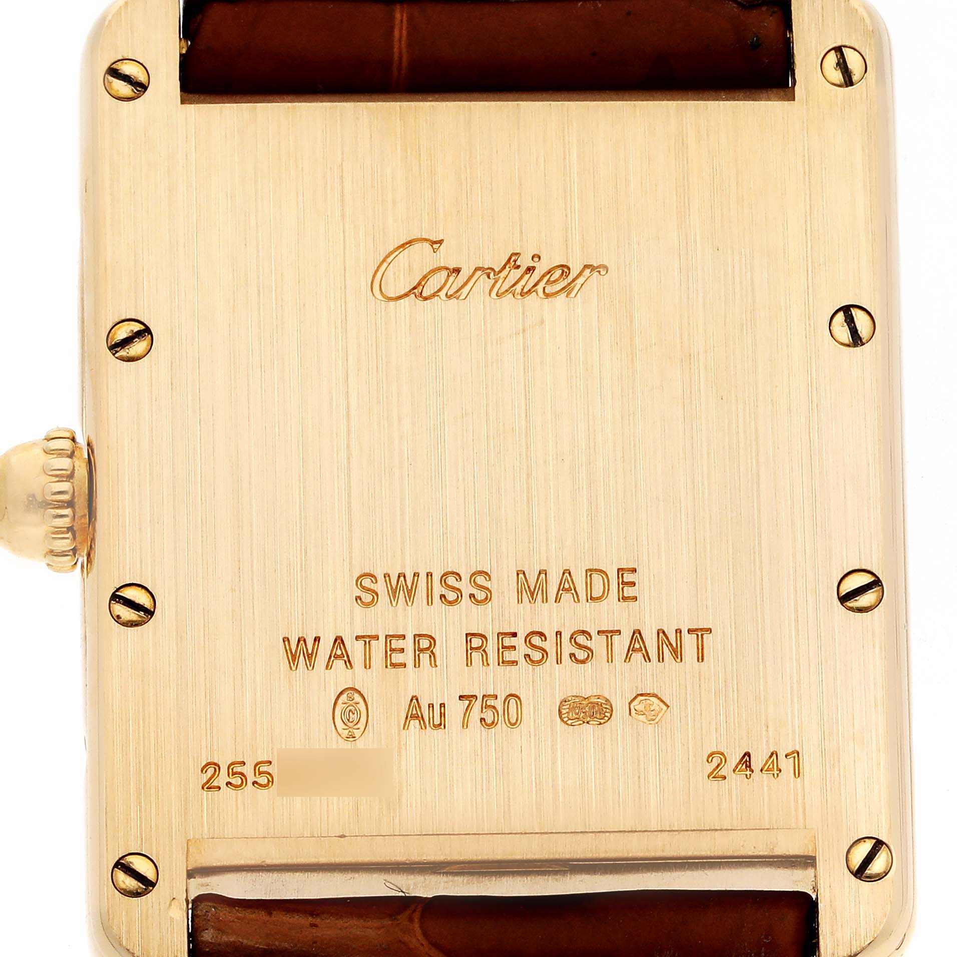 The image shows the back case of a Cartier Tank Louis W1529756 Men's Yellow Gold Silver Dial W1529756 Men's Yellow Gold Silver Dial watch, displaying its inscriptions and four screw heads.