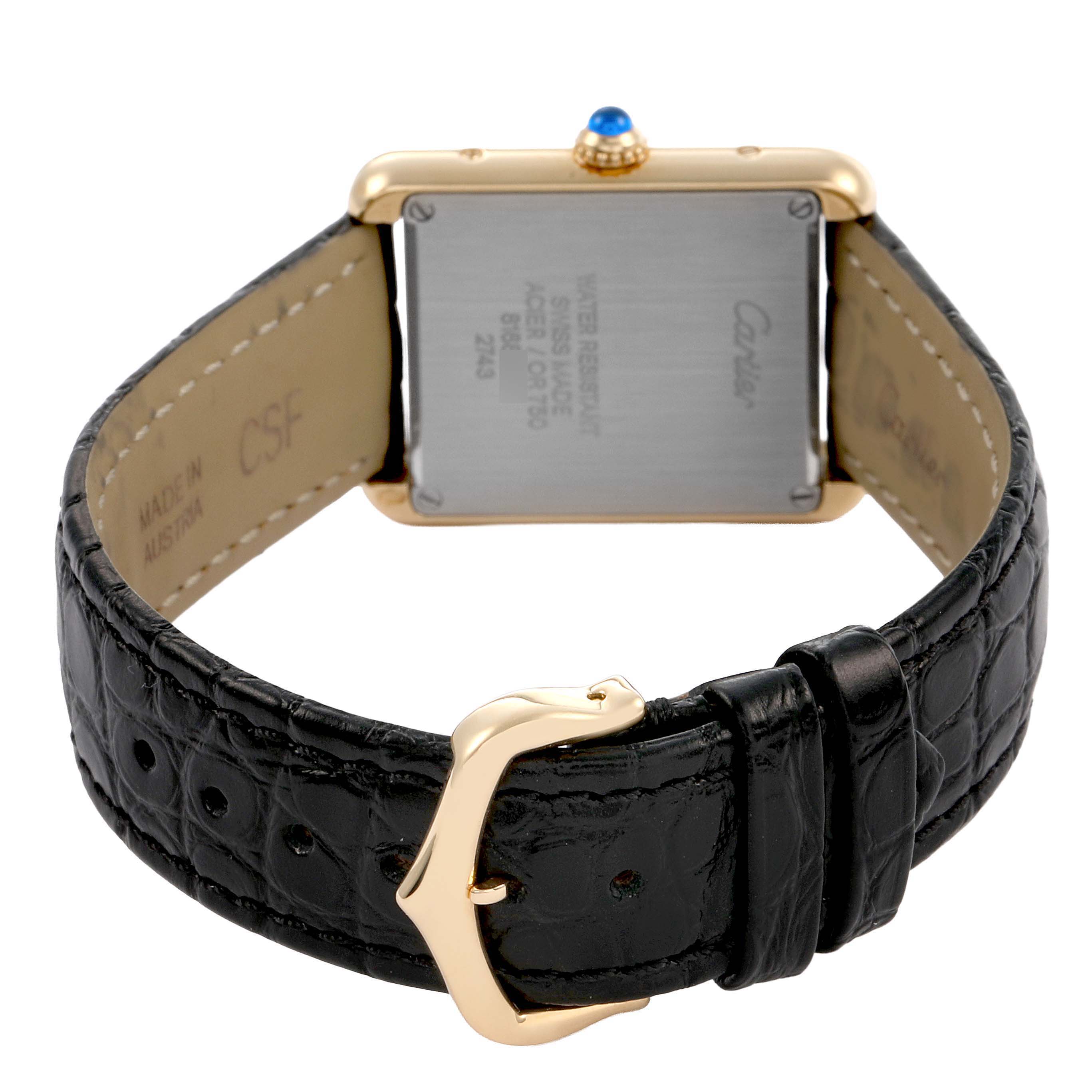 The Cartier Tank Solo W1018755 Women's Yellow Gold Silver Dial watch is shown from the back, highlighting the strap, buckle, case back, and crown.