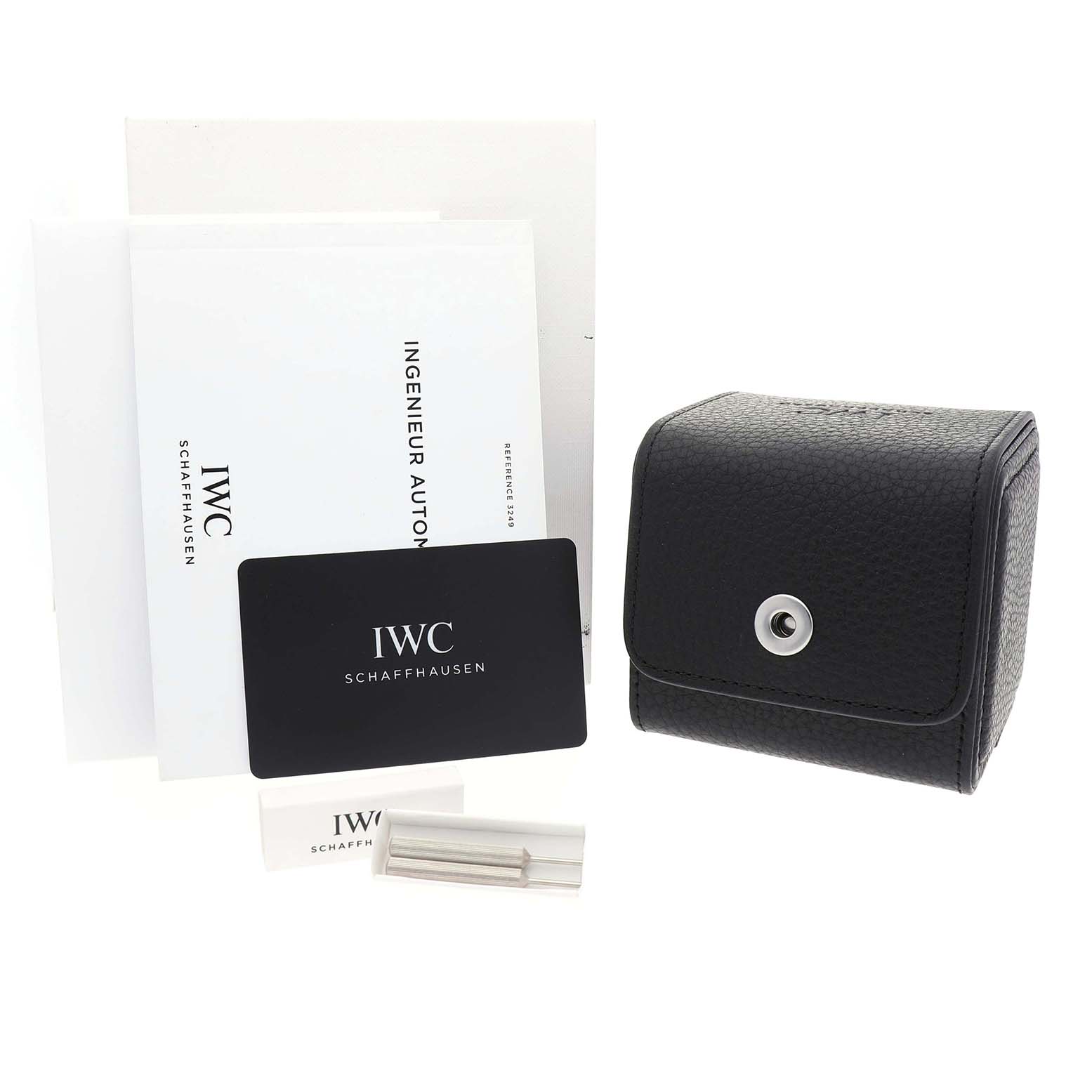 The image shows the IWC IW324901 Women's Stainless Steel Silver Dial Ingenieur 35's accessories, including a card, papers, and a black case.