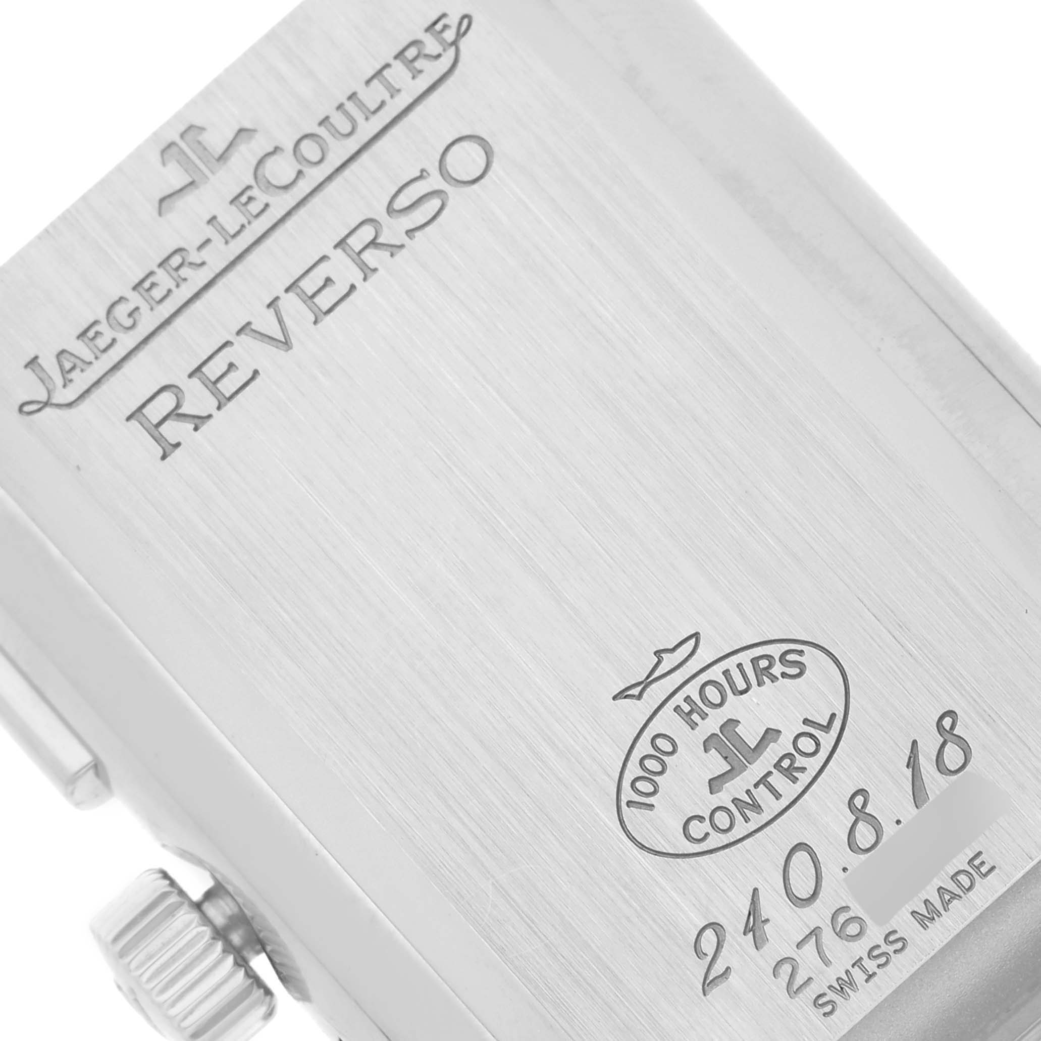 This image shows a close-up view of the case back of a Jaeger-LeCoultre Reverso watch, highlighting the branding and engravings.
