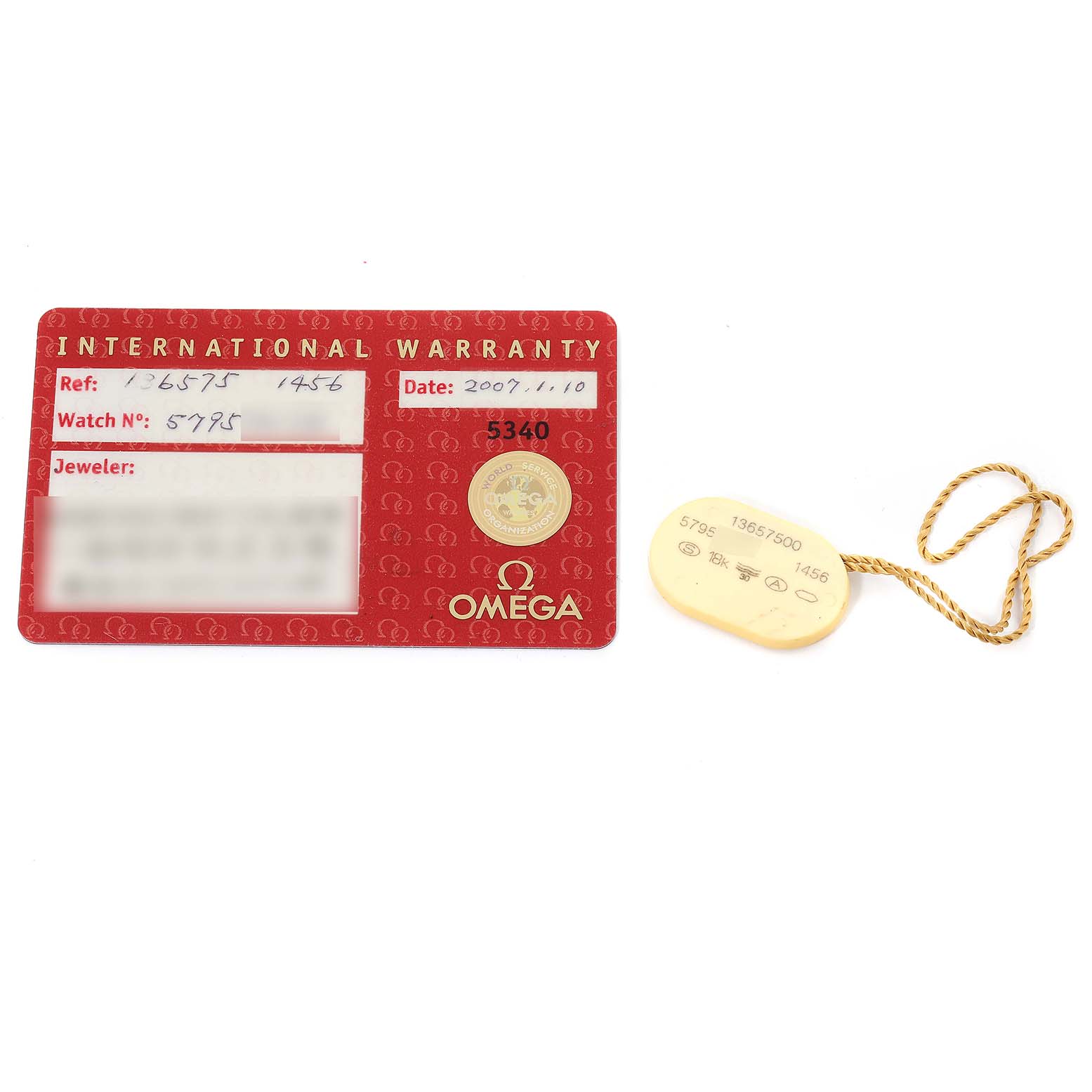 The image shows an international warranty card and a tag for the Omega 1365.75.00 Women's Steel and Gold (two tone) Mother of Pearl Dial 1365.75.00 Women's Steel and Gold (two tone) Mother of Pearl Dial Constellation Steel Yellow Gold Diamond Ladies Watch 1365.75.00.