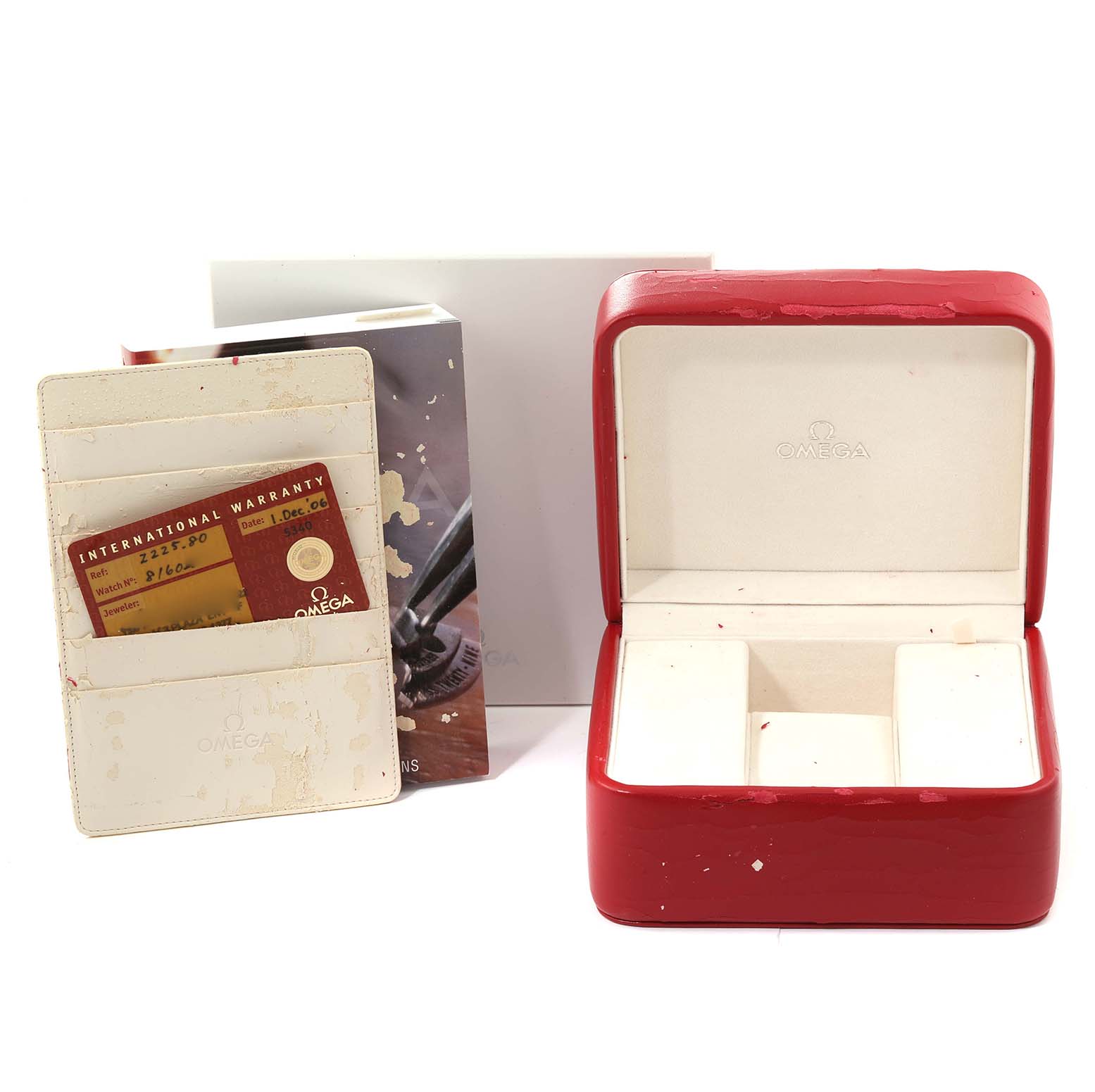 The image shows an Omega Seamaster 2225.80.00 Men
s Stainless Steel Blue Dial 2225.80.00 Men
s Stainless Steel Blue Dial watch box, a warranty card holder, and accompanying booklets.