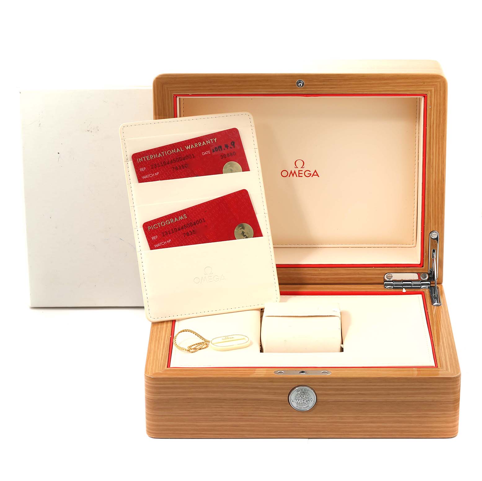 The image shows the open wooden box of the Omega Aqua Terra 231.10.44.50.04.001 Men
s Stainless Steel White Dial 231.10.44.50.04.001 Men
s Stainless Steel White Dial model, containing warranty cards and accessories.