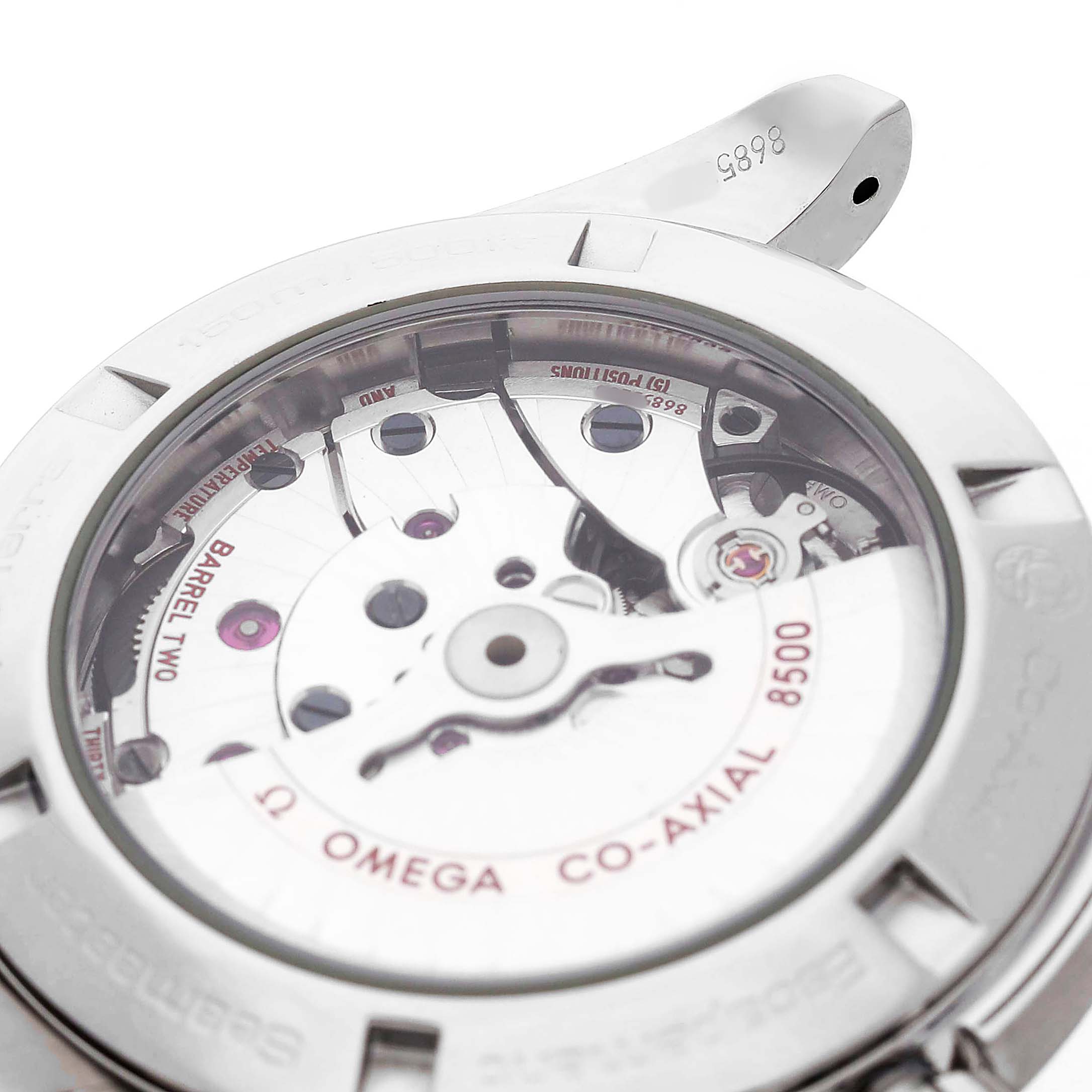 The image shows a back view of the Omega Aqua Terra 231.10.42.21.01.001 Men's Stainless Steel Black Dial, highlighting its Co-Axial 8500 movement through the transparent case back.