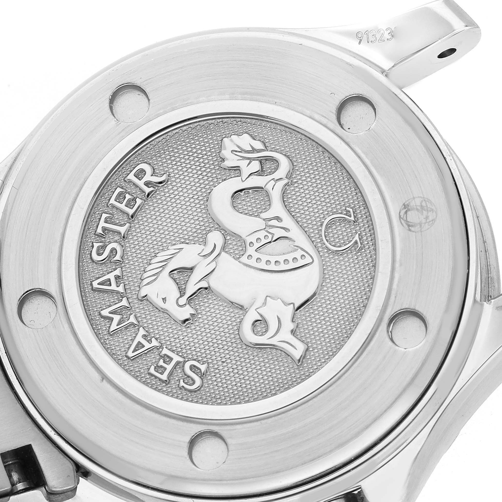 The image shows the back of an Omega 2224.80.00 Women
s Stainless Steel Blue Dial Seamaster Diver 300M 28mm, featuring the engraved emblem and branding details.