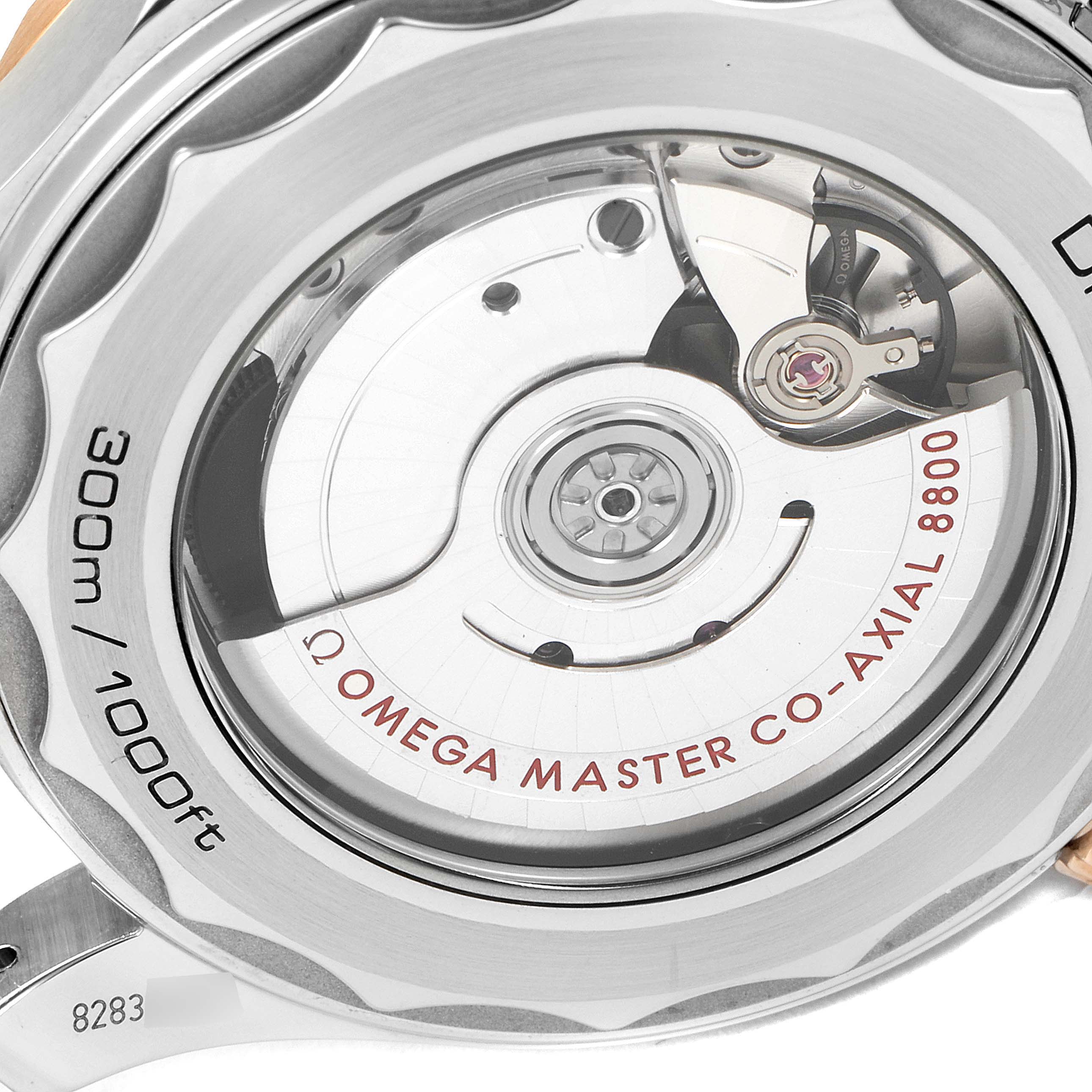 The image shows the case back of an Omega Seamaster 210.20.42.20.01.001 Men's Steel and Gold (two tone) Black Dial 210.20.42.20.01.001 Men's Steel and Gold (two tone) Black Dial watch, revealing its Omega Master Co-Axial 8800 movement.