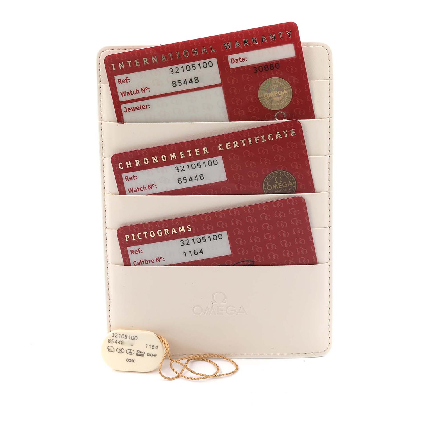 The image shows a set of cards and a tag for the Omega Speedmaster 3210.51.00 Men
s Stainless Steel Black Dial watch, including warranty and certification cards.