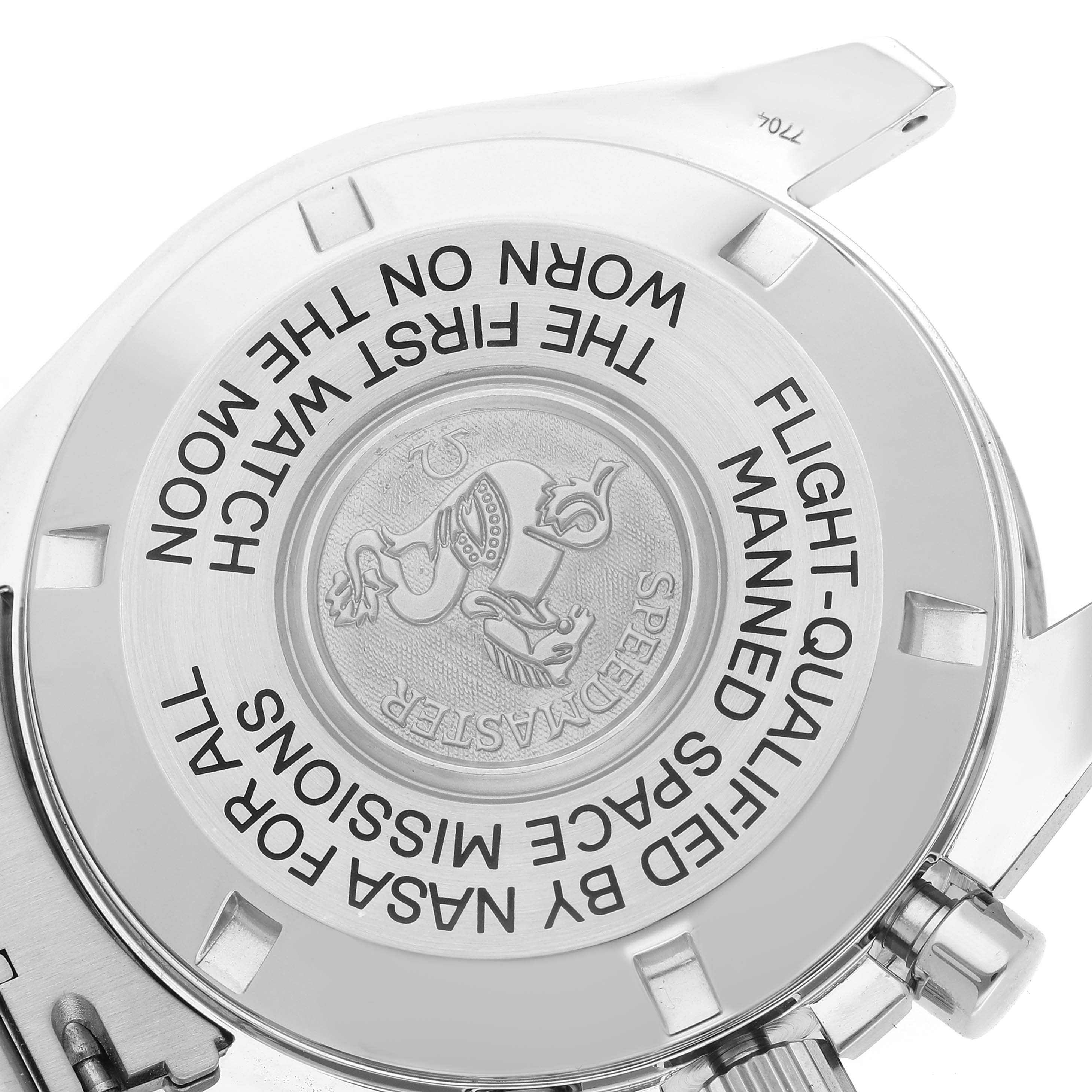 This image shows the back of an Omega Speedmaster 3575.20.00 Men
s Stainless Steel White Dial, highlighting the engraved commemorative text and emblem.