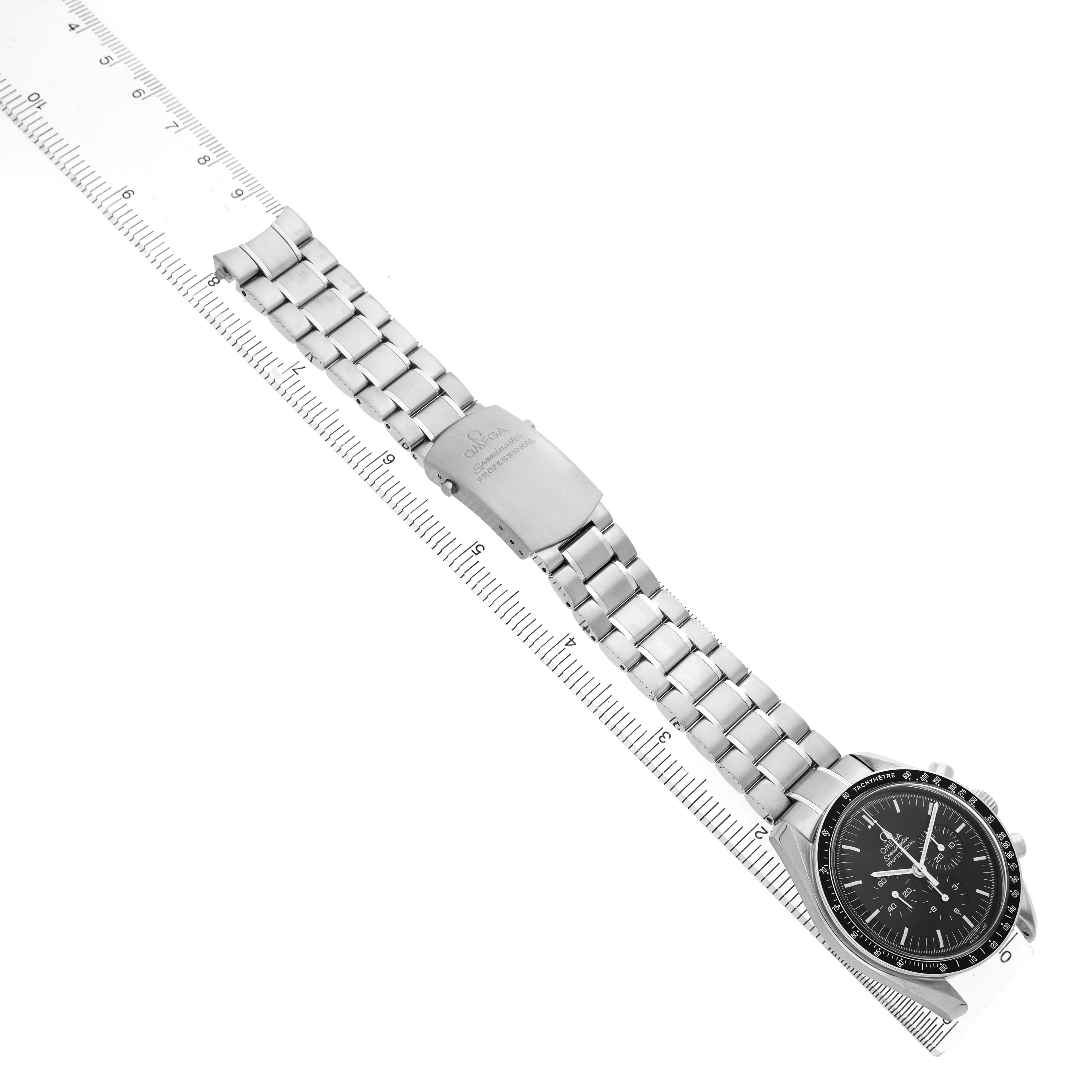 The Omega Speedmaster 311.30.42.30.01.005 Men's Stainless Steel Black Dial watch is displayed at an angle, highlighting the full bracelet, clasp, and face with a ruler for scale.