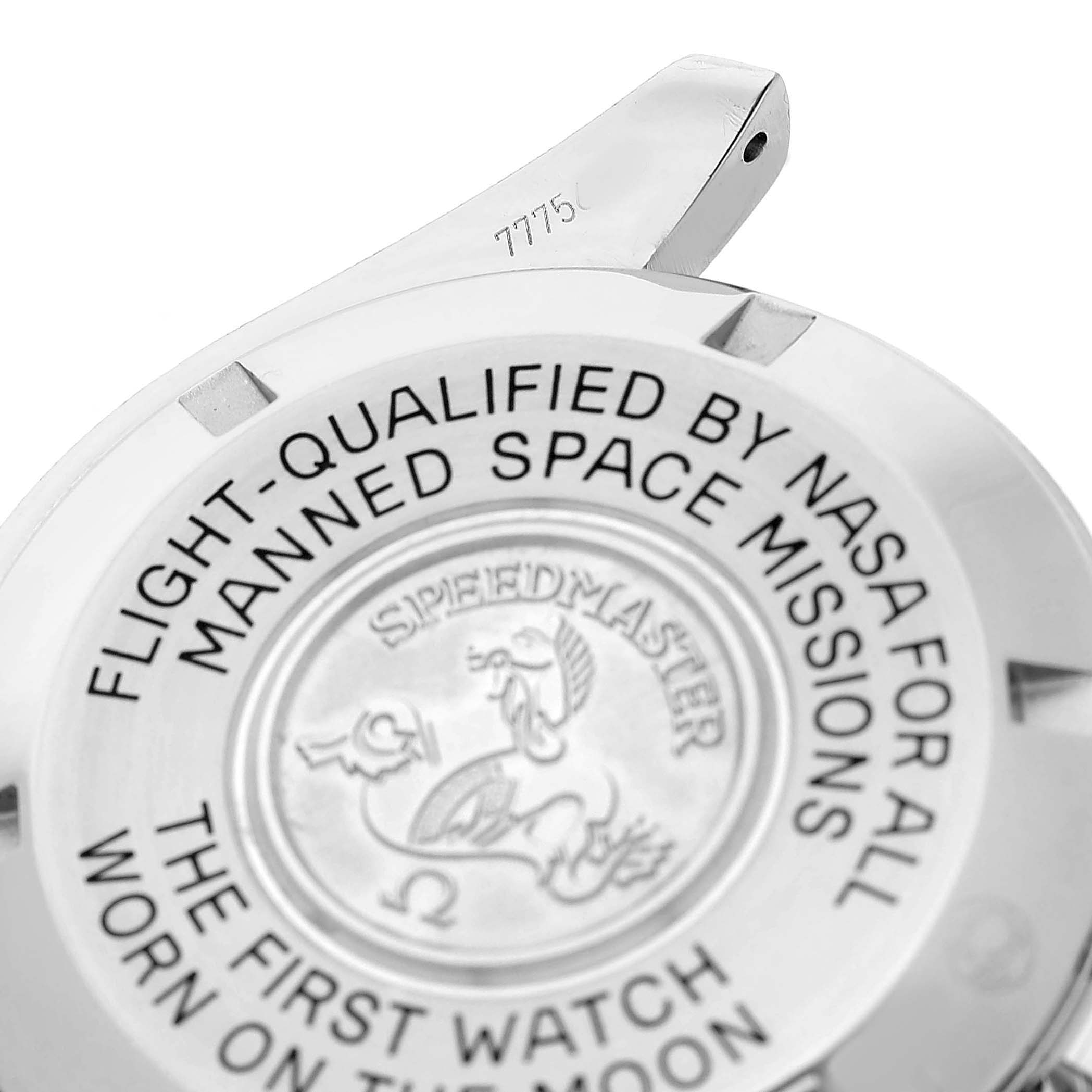 The image shows the back case of an Omega Speedmaster 311.30.42.30.01.005 Men's Stainless Steel Black Dial, featuring engraved text and a logo.