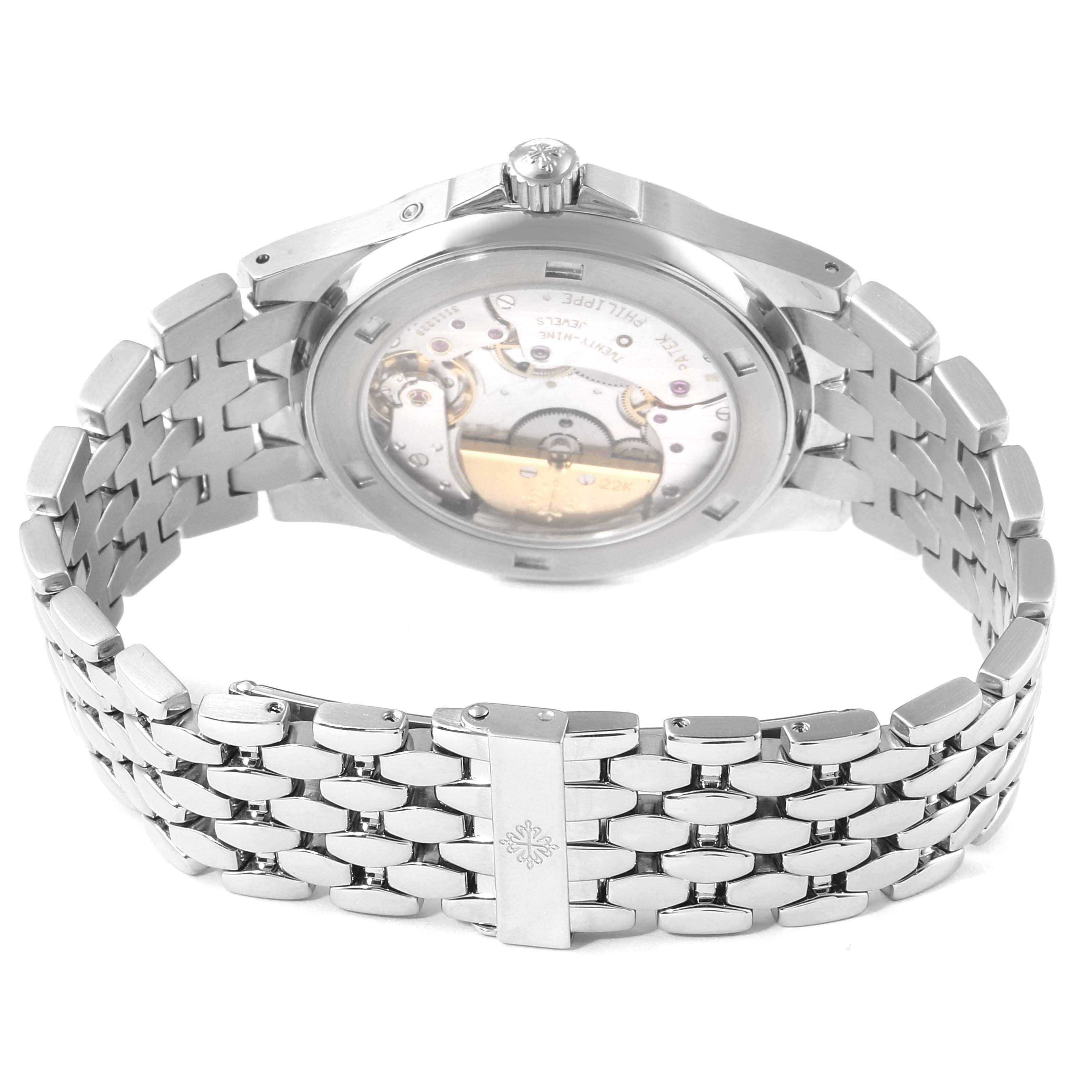 The image shows the back view of a Patek Philippe Neptune 5085A/1A-001 Men's Stainless Steel Black Dial 5085A/1A-001 Men's Stainless Steel Black Dial model watch, highlighting its mechanical movement and metal bracelet.