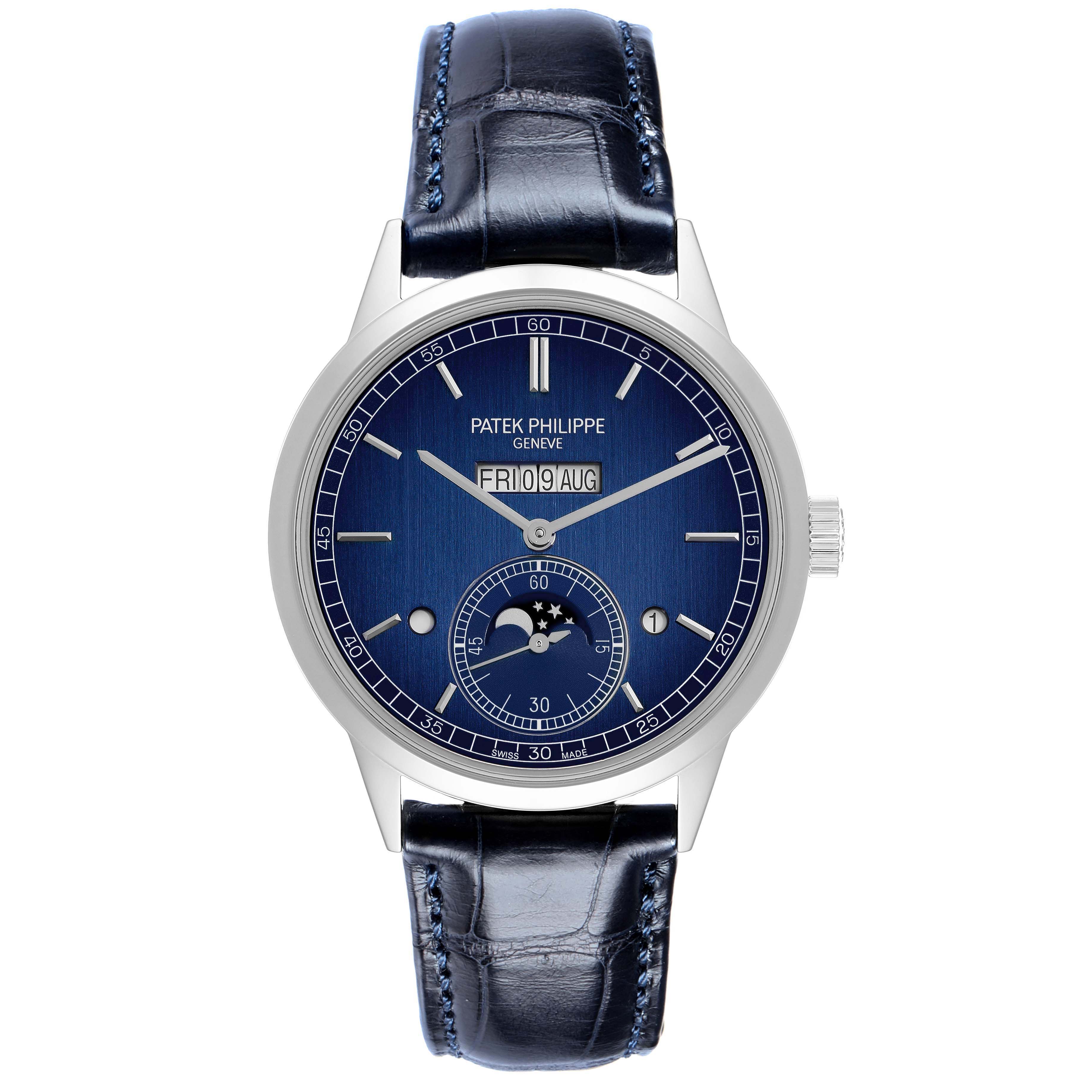 The image shows a front view of a Patek Philippe Complications 5236P-001 Men
s Platinum Blue Dial watch, highlighting its dial, hands, and strap.