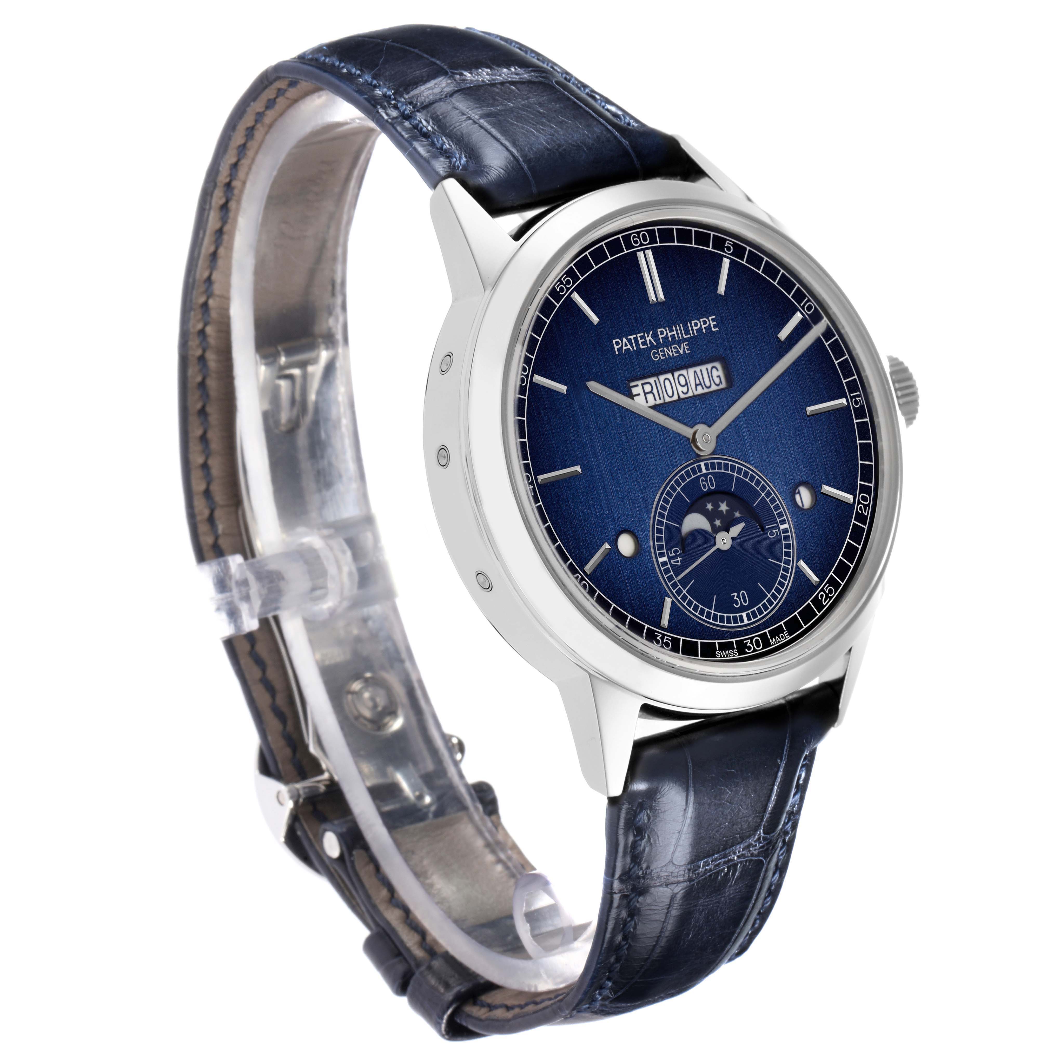The Patek Philippe Complications 5236P-001 Men
s Platinum Blue Dial watch is shown at a three-quarter angle, displaying the face, strap, and buckle.