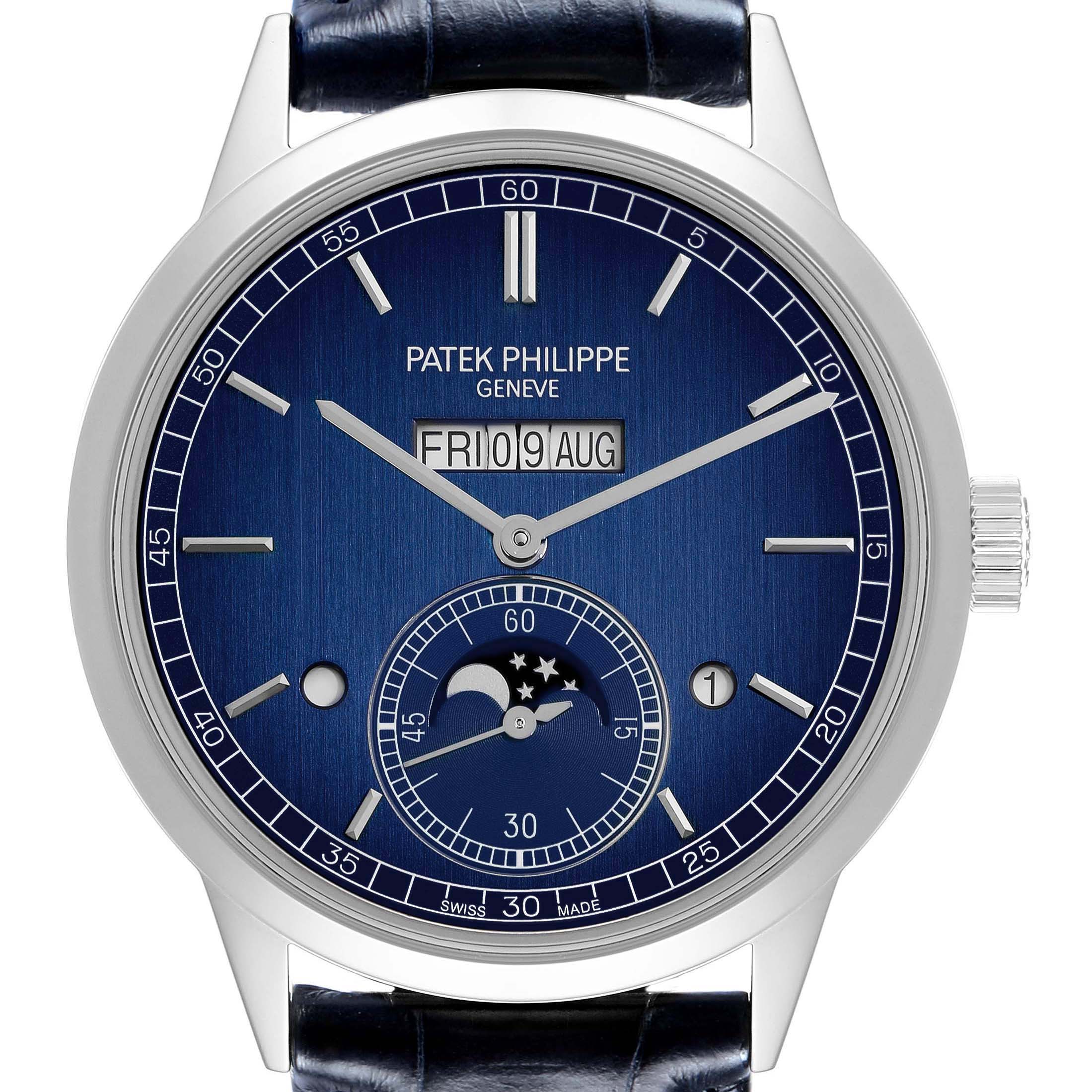 The Patek Philippe Complications 5236P-001 Men
s Platinum Blue Dial watch is shown from a front view, featuring a blue dial with date and moon phase indicators.