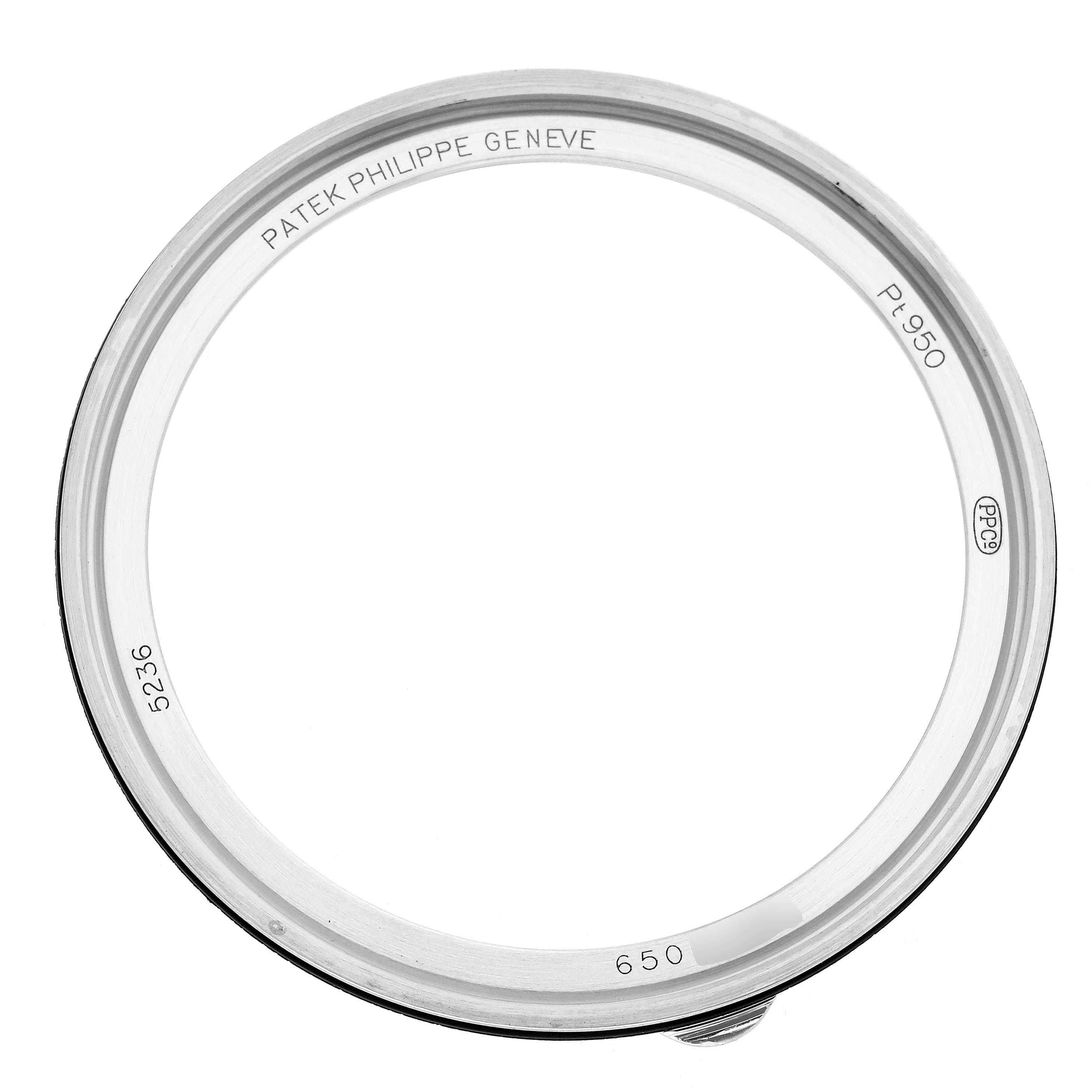 The image shows the bezel of a Patek Philippe Complications 5236P-001 Men
s Platinum Blue Dial watch from a top-down angle.