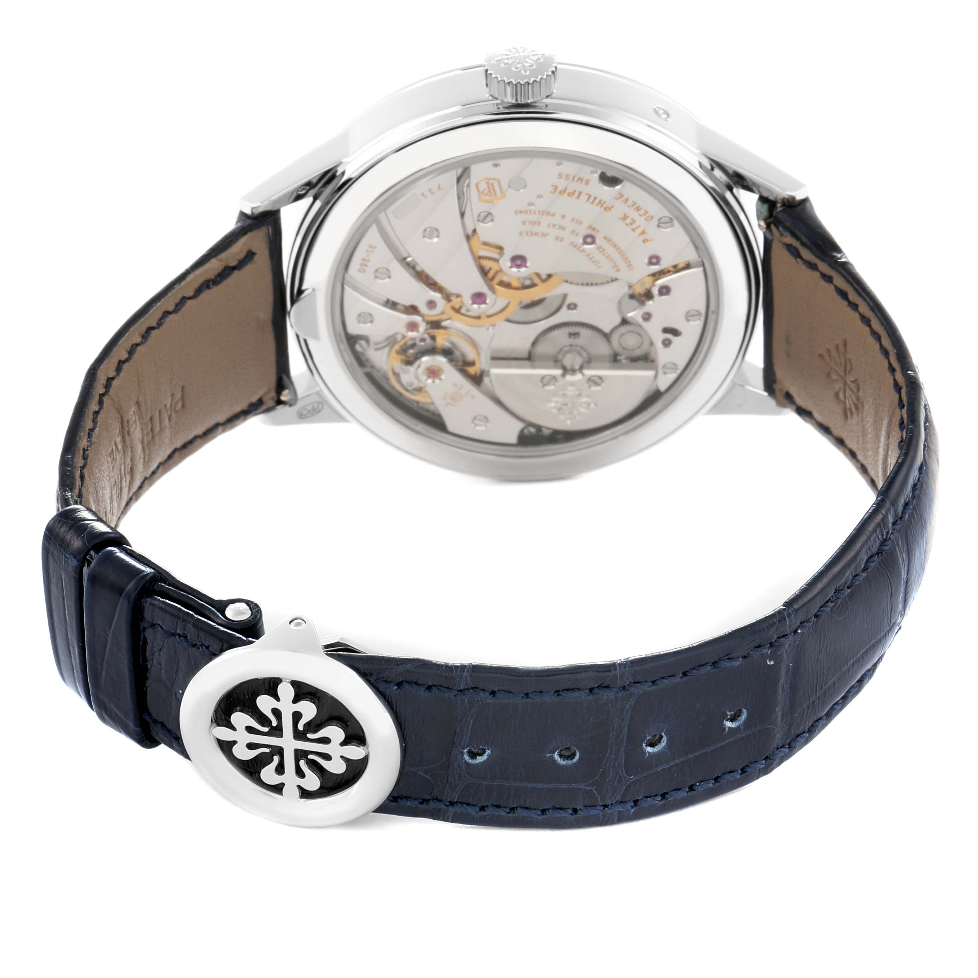 The image shows the back view of a Patek Philippe Complications 5236P-001 Men
s Platinum Blue Dial watch, highlighting the movement and the clasp on the strap.